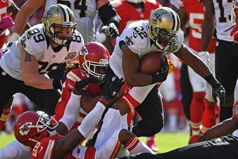 KANSAS CITY, MO - OCTOBER 23:  Running back Mark Ingram #22 of the New Orleans Saints rushes against pressure from defenders of the Kansas City Chiefs during the second half on October 23, 2016 at Arrowhead Stadium in Kansas City, Missouri.  (Photo by Pet
