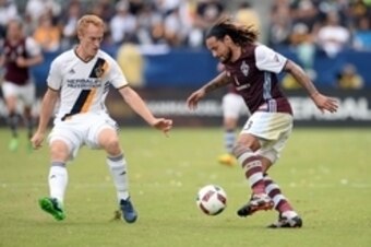 October 30, 2016; Carson, CA, USA;  Colorado Rapids midfielder Jermaine Jones (13) moves the ball against the defense of Los Angeles Galaxy defender Jeff Larentowicz (21) during the second half at StubHub Center. Mandatory Credit: Gary A. Vasquez-USA TODA
