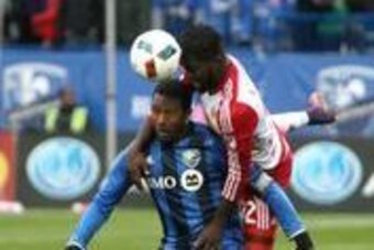 Oct 30, 2016; Montreal , Canada; Montreal Impact midfielder Patrice Bernier (8) heads the ball next to New York Red Bulls defender Kemar Lawrence (92) during the first half at Stade Saputo. Mandatory Credit: Jean-Yves Ahern-USA TODAY Sports