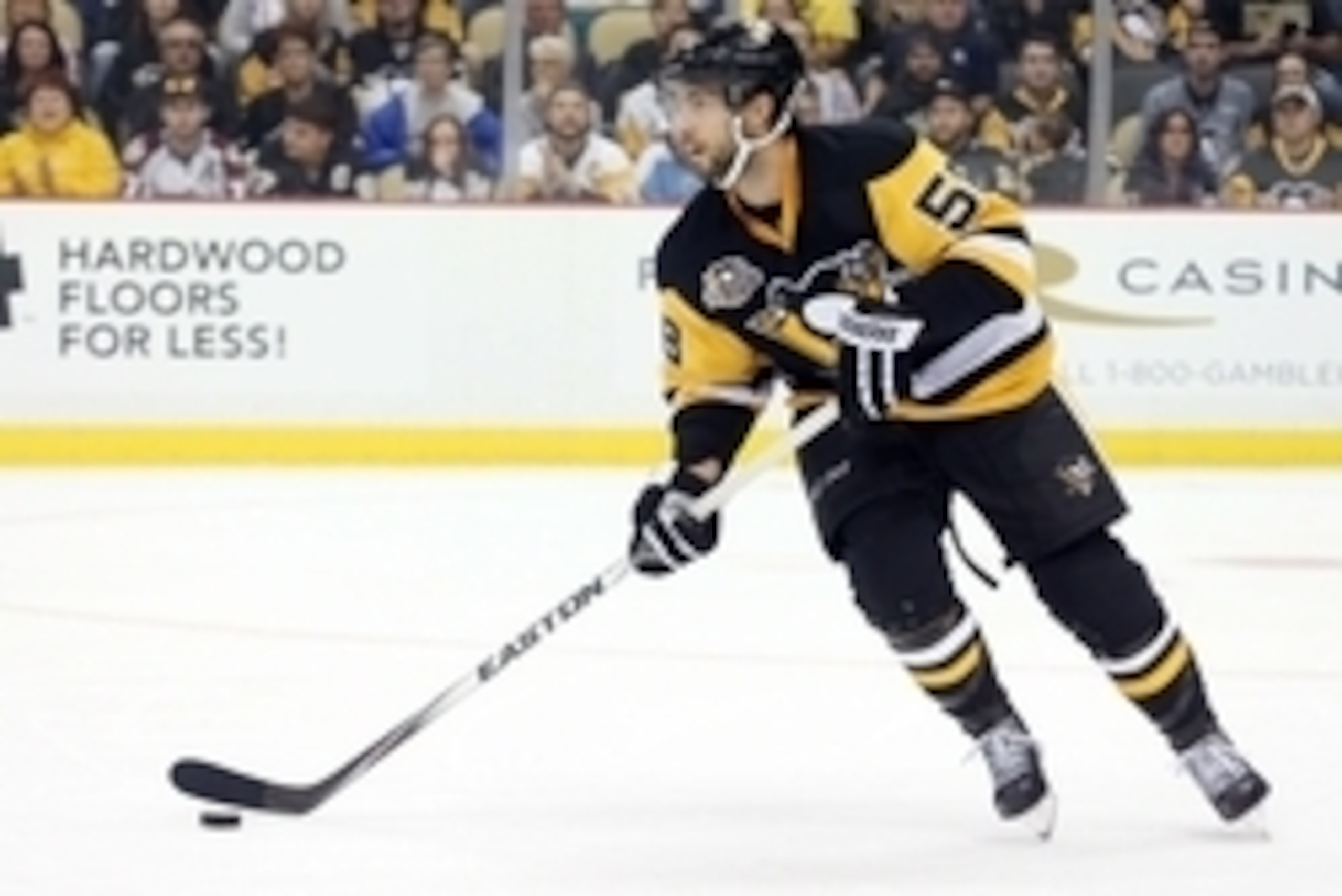 Oct 17, 2016; Pittsburgh, PA, USA;  Pittsburgh Penguins defenseman Kris Letang (58) handles the puck against the Colorado Avalanche during the second period at the PPG Paints Arena. The Avalanche won 4-3 in overtime. Mandatory Credit: Charles LeClaire-USA