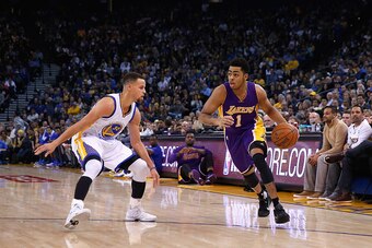 OAKLAND, CA - JANUARY 14:  D'Angelo Russell #1 of the Los Angeles Lakers is covered by Stephen Curry #30 of the Golden State Warriors at ORACLE Arena on January 14, 2016 in Oakland, California. NOTE TO USER: User expressly acknowledges and agrees that, by