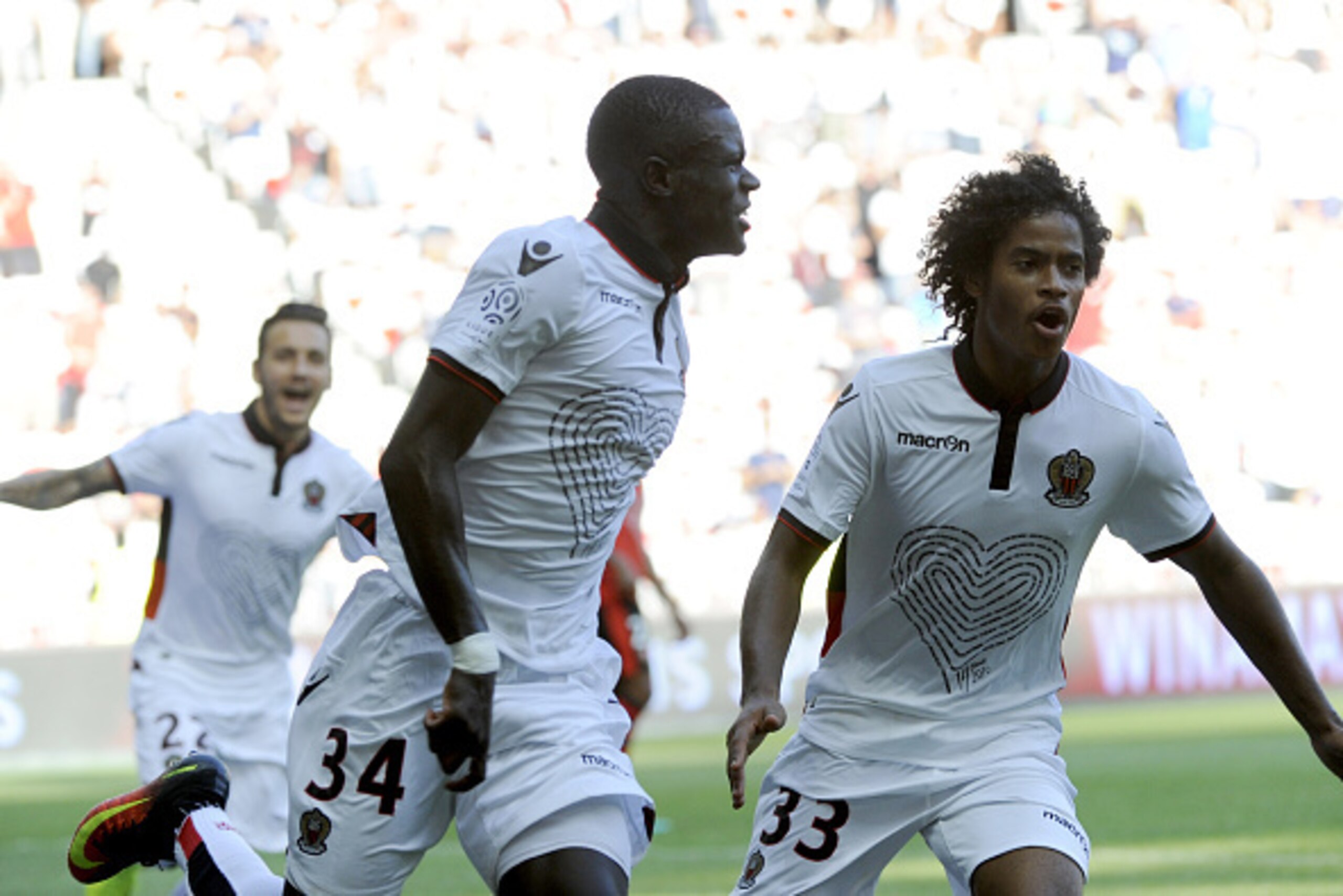 Nices French defender Malang Sarr (C) gestures as he celebrates his goal during the French L1 football match between OGC Nice and Rennes on August 14, 2016, at the Allianz Riviera stadium in Nice, southern France. / AFP / Franck PENNANT        (Photo cred