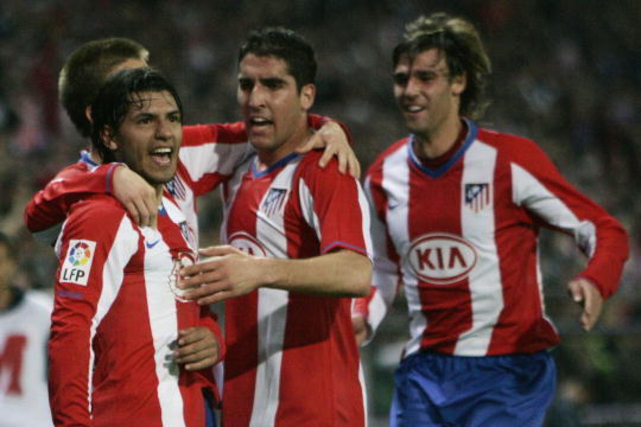 Athletico Madrid's Kun Aguero (L) is congratuled by his teamates Leo Franco (C) and Juan Valera (R) after scoring during a Spanish League football match Athletico Madrid v Barcelona at a Vicente Calderon stadium in Madrid, on Athletico Madrid's Kun Aguero (L) is congratuled by his teamates Leo Franco (C) and Juan Valera (R) after scoring during a Spanish League football match Athletico Madrid v Barcelona at a Vicente Calderon stadium in Madrid, on