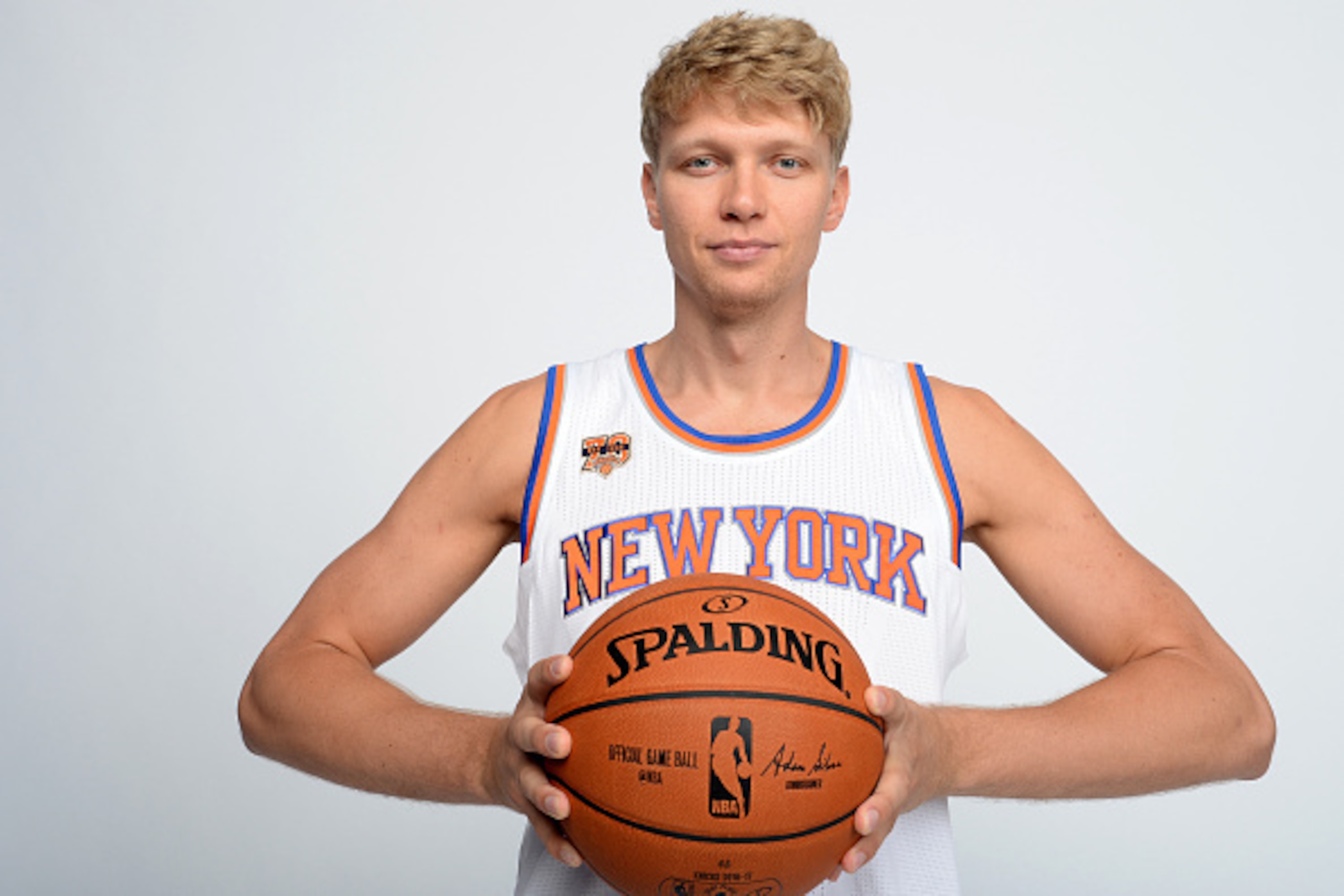 WHITE PLAINS, NY - SEPTEMBER 26:  Mindaugas Kuzminskas #91 of the New York Knicks poses for a portrait during media day at the Ritz Carlton in White Plains, New York on September 26, 2016. NOTE TO USER: User expressly acknowledges and agrees that, by down