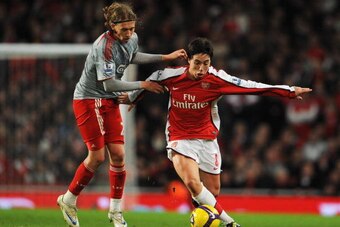 LONDON - DECEMBER 21:  Samir Nasri of Arsenal holds off Lucas of Liverpool during the Barclays Premier League match between Arsenal and Liverpool at the Emirates Stadium on December 21, 2008 in London, England.  (Photo by Clive Mason/Getty Images)