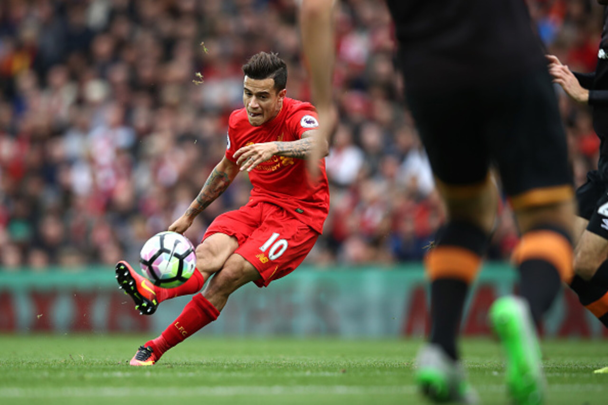 LIVERPOOL, ENGLAND - SEPTEMBER 24:  Philippe Coutinho of Liverpool scores their fourth goal during the Premier League match between Liverpool and Hull City at Anfield on September 24, 2016 in Liverpool, England.  (Photo by Julian Finney/Getty Images)