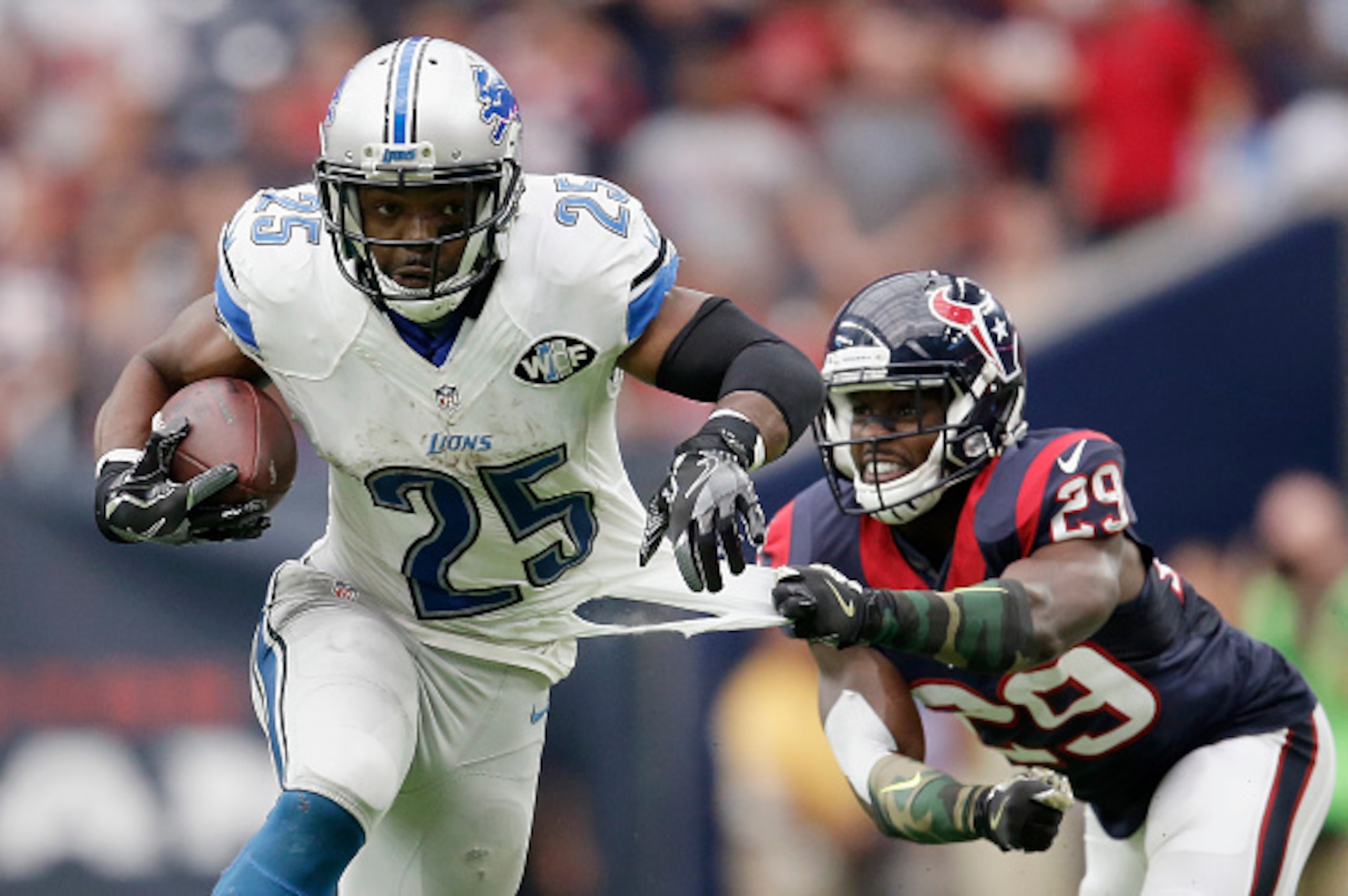 HOUSTON, TX - OCTOBER 30:  Andre Hal #29 of the Houston Texans grabs the jersey of Theo Riddick #25 of the Detroit Lions in the fourth quarter at NRG Stadium on October 30, 2016 in Houston, Texas.  (Photo by Thomas B. Shea/Getty Images)