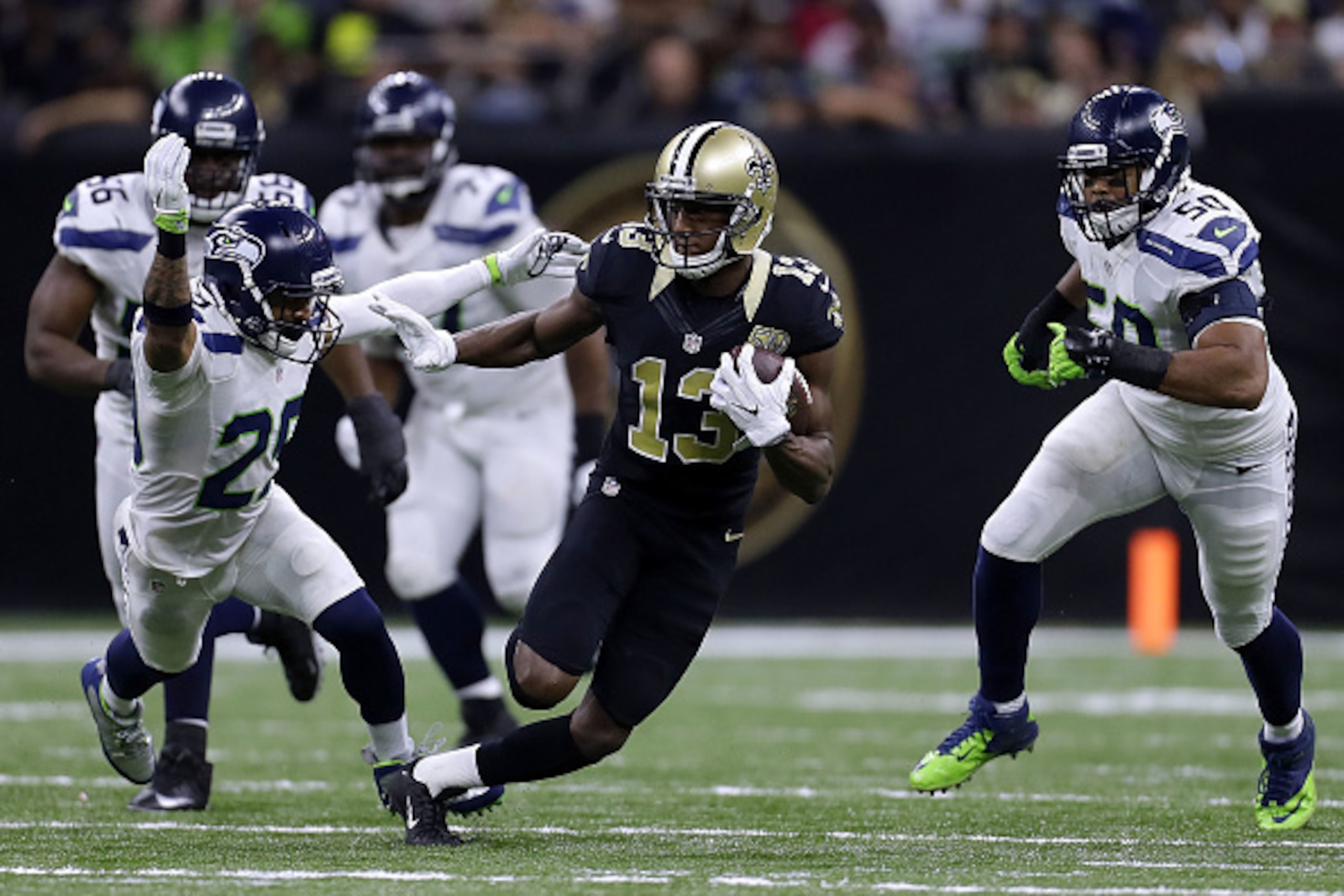 NEW ORLEANS, LA - OCTOBER 30: Michael Thomas #13 of the New Orleans Saints runs with the ball during the second half of a game against the Seattle Seahawks at the Mercedes-Benz Superdome on October 30, 2016 in New Orleans, Louisiana.  (Photo by Jonathan B
