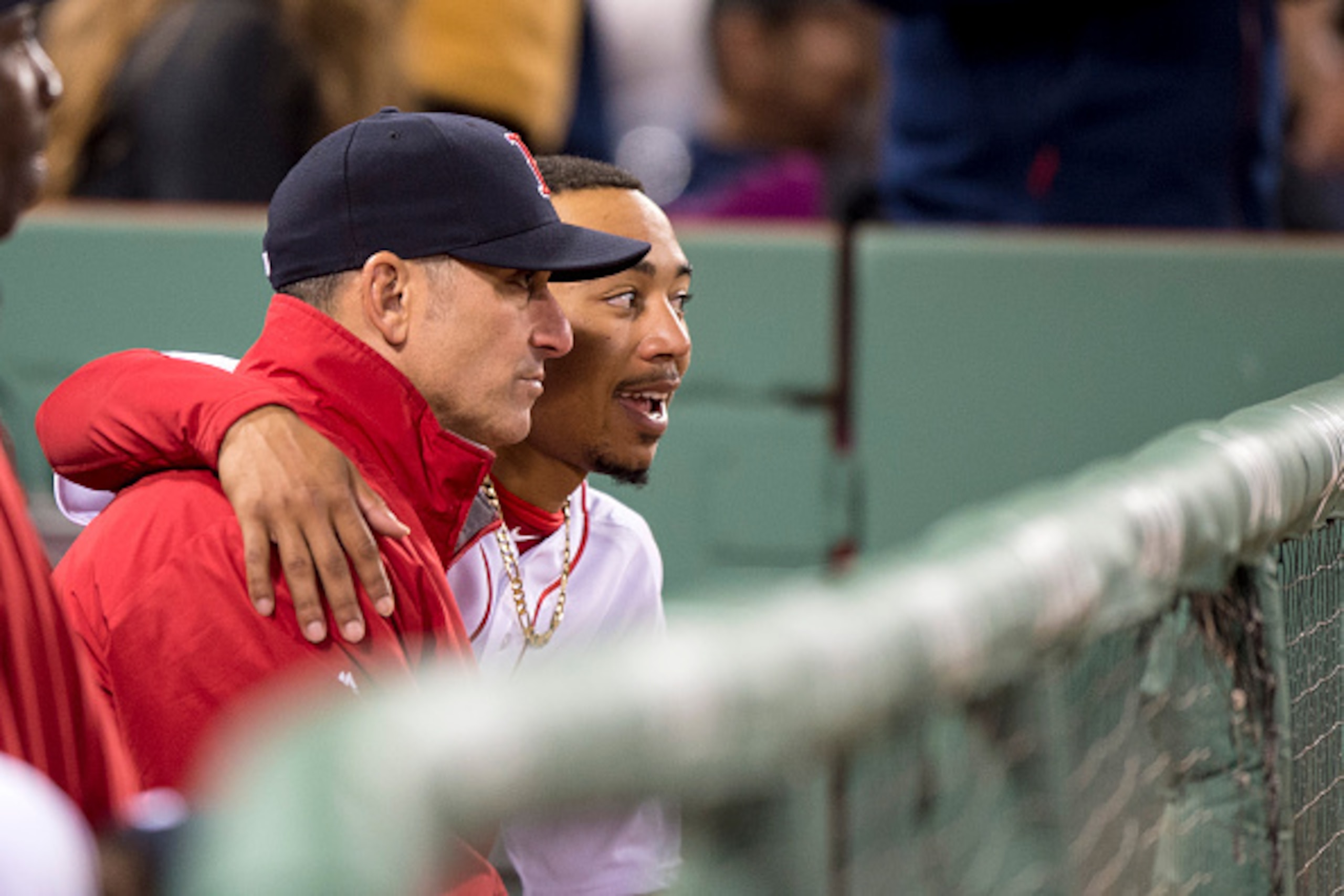BOSTON, MA - APRIL 20: Mookie Betts #50 of the Boston Red Sox talks with bench coach Torey Lovullo during the fifth inning of a game against the Tampa Bay Rays on April 20, 2016 at Fenway Park in Boston, Massachusetts . (Photo by Billie Weiss/Boston Red S
