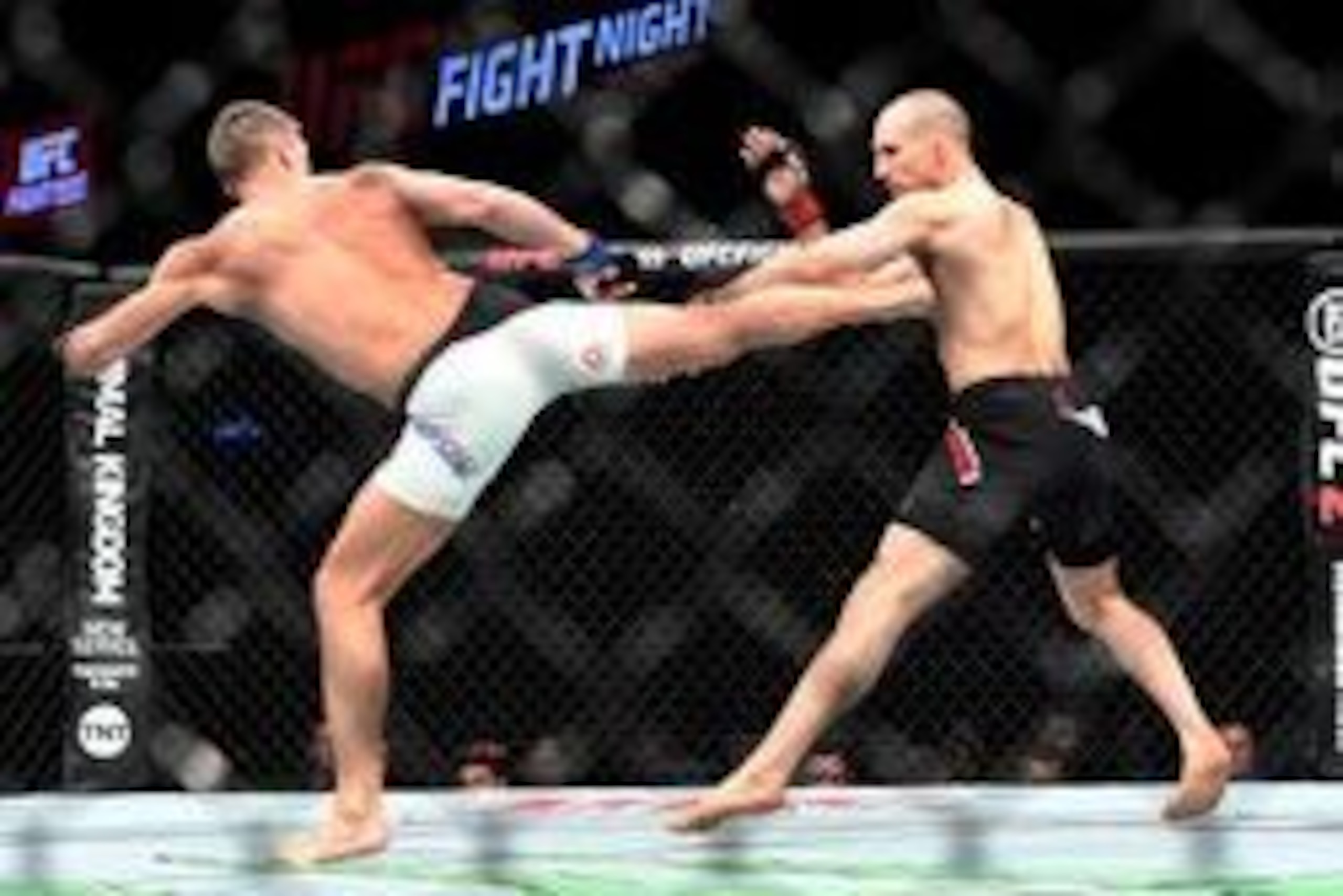 Jun 18, 2016; Ottawa, Ontario, Canada; Stephen Thompson (blue gloves) fights Rory MacDonald (red gloves) during UFC Fight Night at TD Place Arena. Mandatory Credit: Marc DesRosiers-USA TODAY Sports