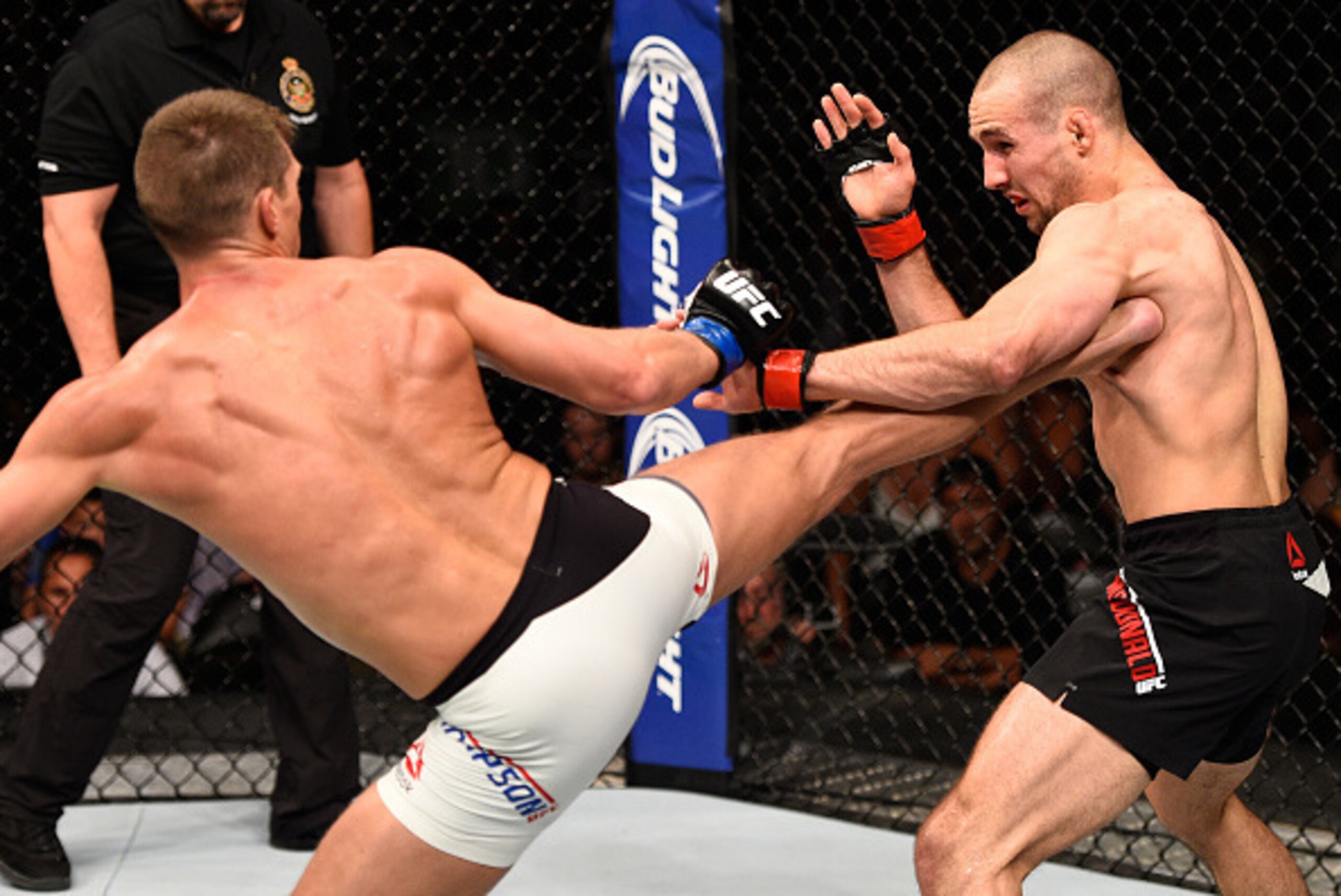 OTTAWA, ON - JUNE 18:   (L-R) Stephen Thompson of the United States kicks Rory MacDonald of Canada in their welterweight bout during the UFC Fight Night event inside the TD Place Arena on June 18, 2016 in Ottawa, Ontario, Canada. (Photo by Jeff Bottari/Zu