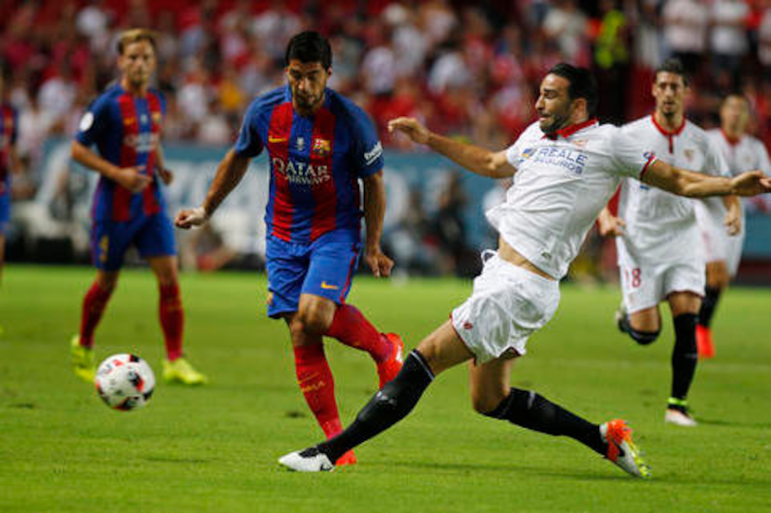 Luis Suarez in action against Sevilla.