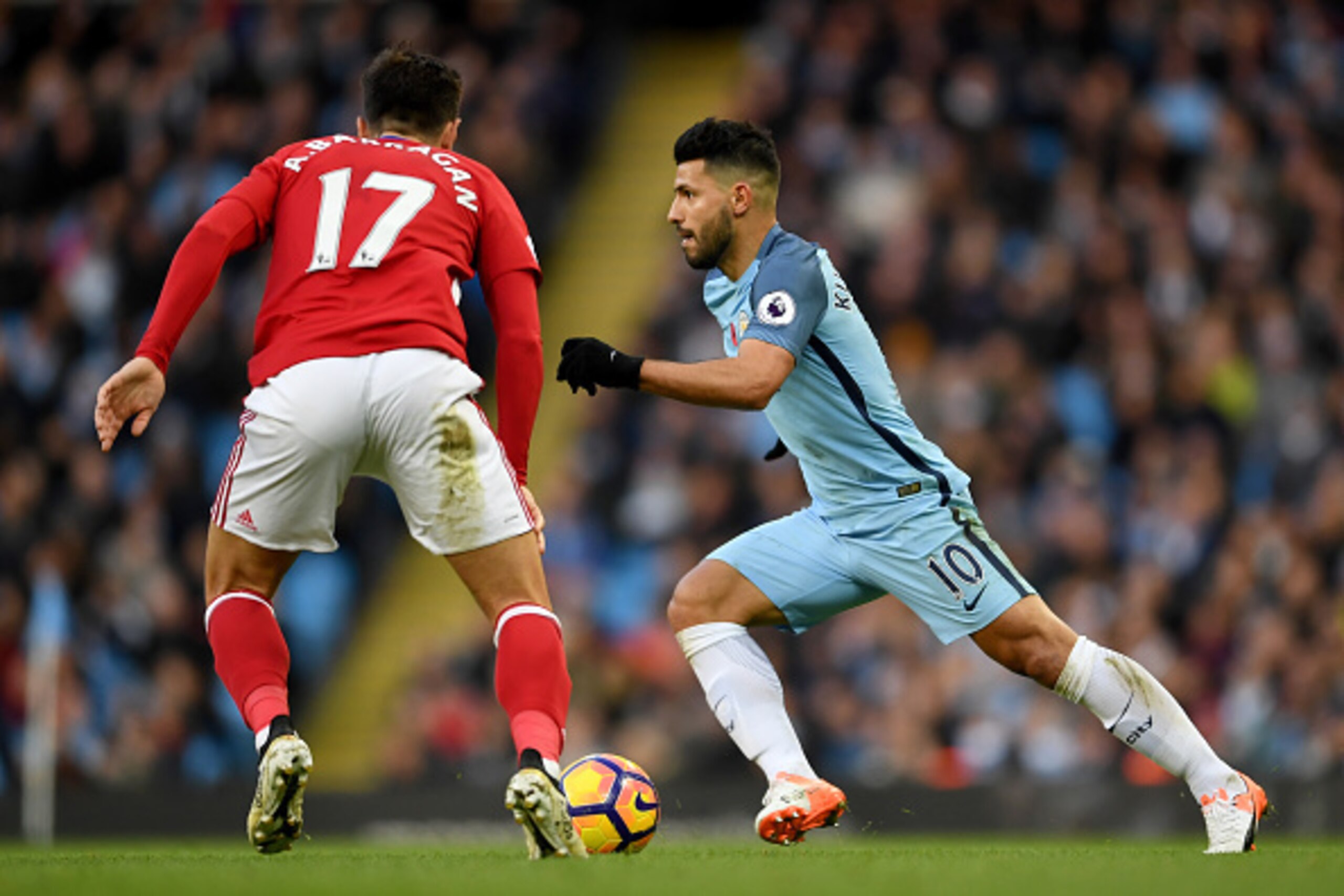 MANCHESTER, ENGLAND - NOVEMBER 05: Sergio Aguero of Manchester City (R) takes the ball past Antonio Barragan of Middlesbrough (L) during the Premier League match between Manchester City and Middlesbrough at Etihad Stadium on November 5, 2016 in Manchester