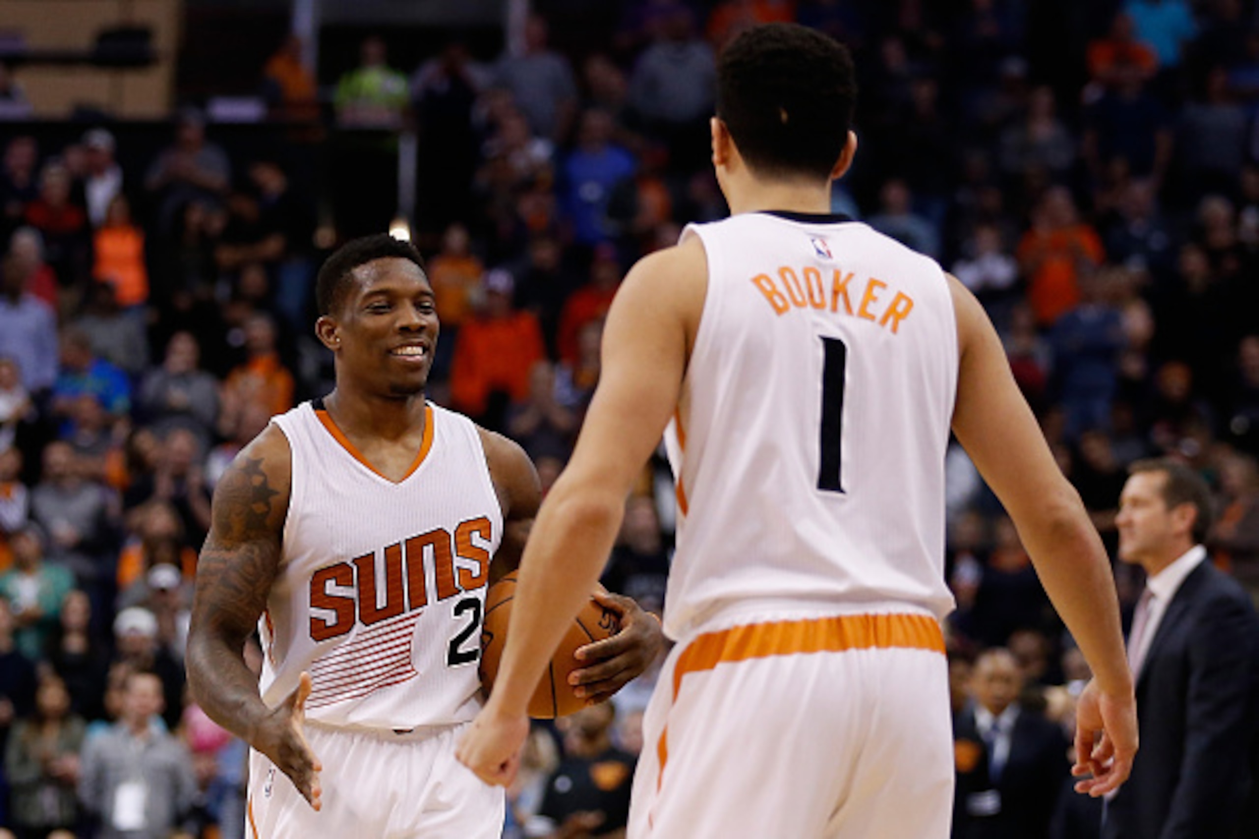 PHOENIX, AZ - DECEMBER 09:  Eric Bledsoe #2 of the Phoenix Suns celebrates with Devin Booker #1 during the final moments of the NBA game against the Orlando Magic at Talking Stick Resort Arena on December 9, 2015 in Phoenix, Arizona.  The Suns defeated th