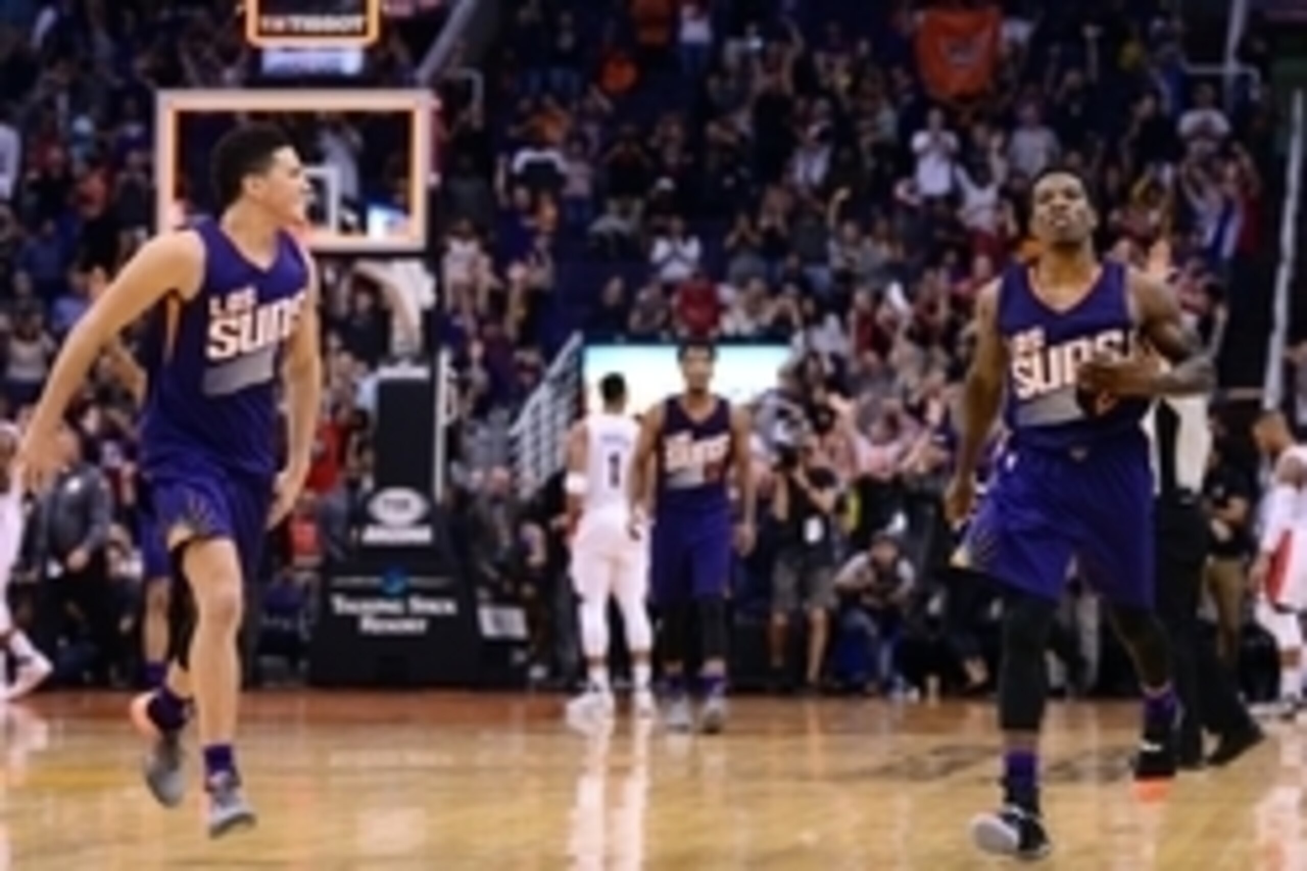 Nov 2, 2016; Phoenix, AZ, USA; Phoenix Suns guard Eric Bledsoe (2) celebrates with guard Devin Booker (1) after making the game winning three point basket against the Portland Trail Blazers during overtime at Talking Stick Resort Arena. The Suns defeated 