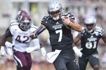 Nov 5, 2016; Starkville, MS, USA;Mississippi State Bulldogs quarterback Nick Fitzgerald (7) carries the ball during the first quarter against the Texas A&M Aggies at Davis Wade Stadium. Mandatory Credit: Matt Bush-USA TODAY Sports