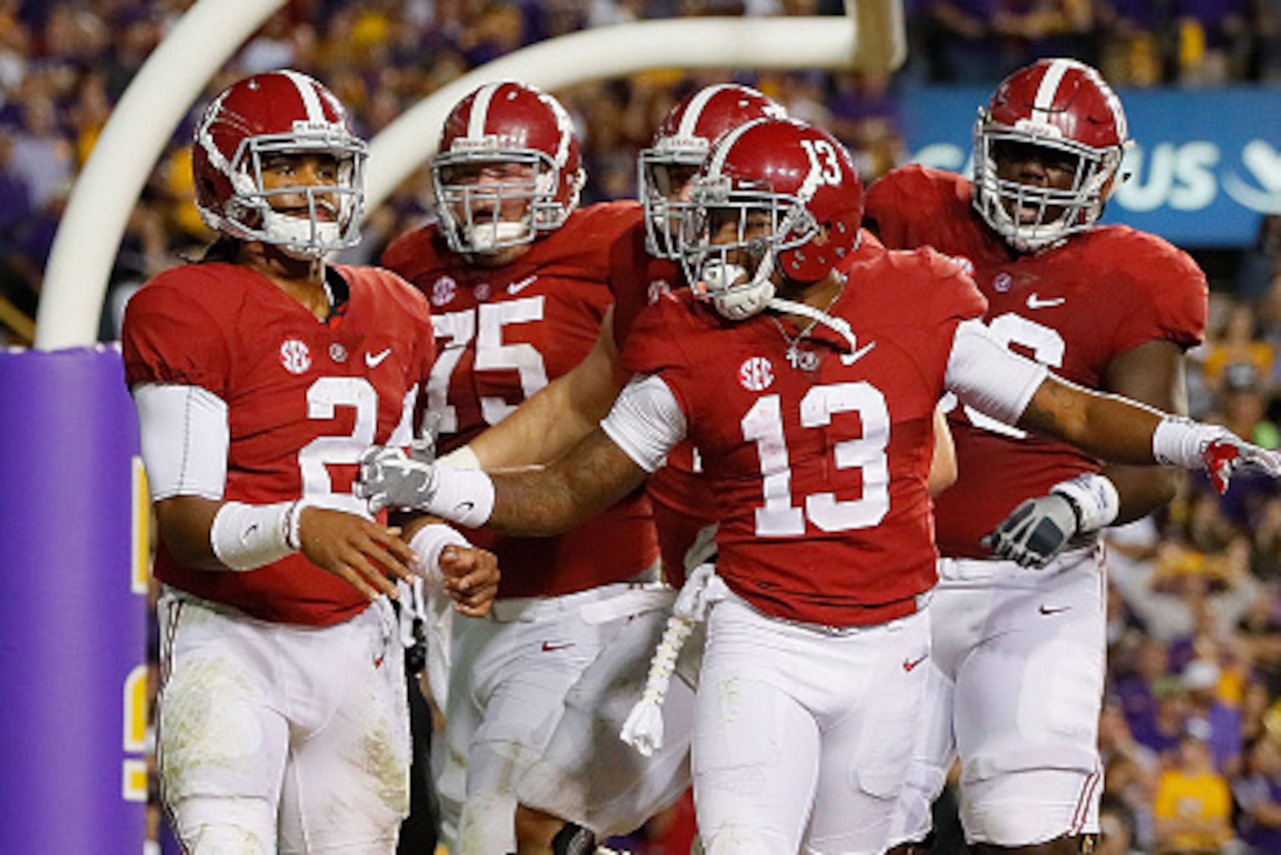 BATON ROUGE, LA - NOVEMBER 05:  Jalen Hurts #2 of the Alabama Crimson Tide is congratulated after rushing for a touchdown against the LSU Tigers at Tiger Stadium on November 5, 2016 in Baton Rouge, Louisiana.  (Photo by Kevin C. Cox/Getty Images)