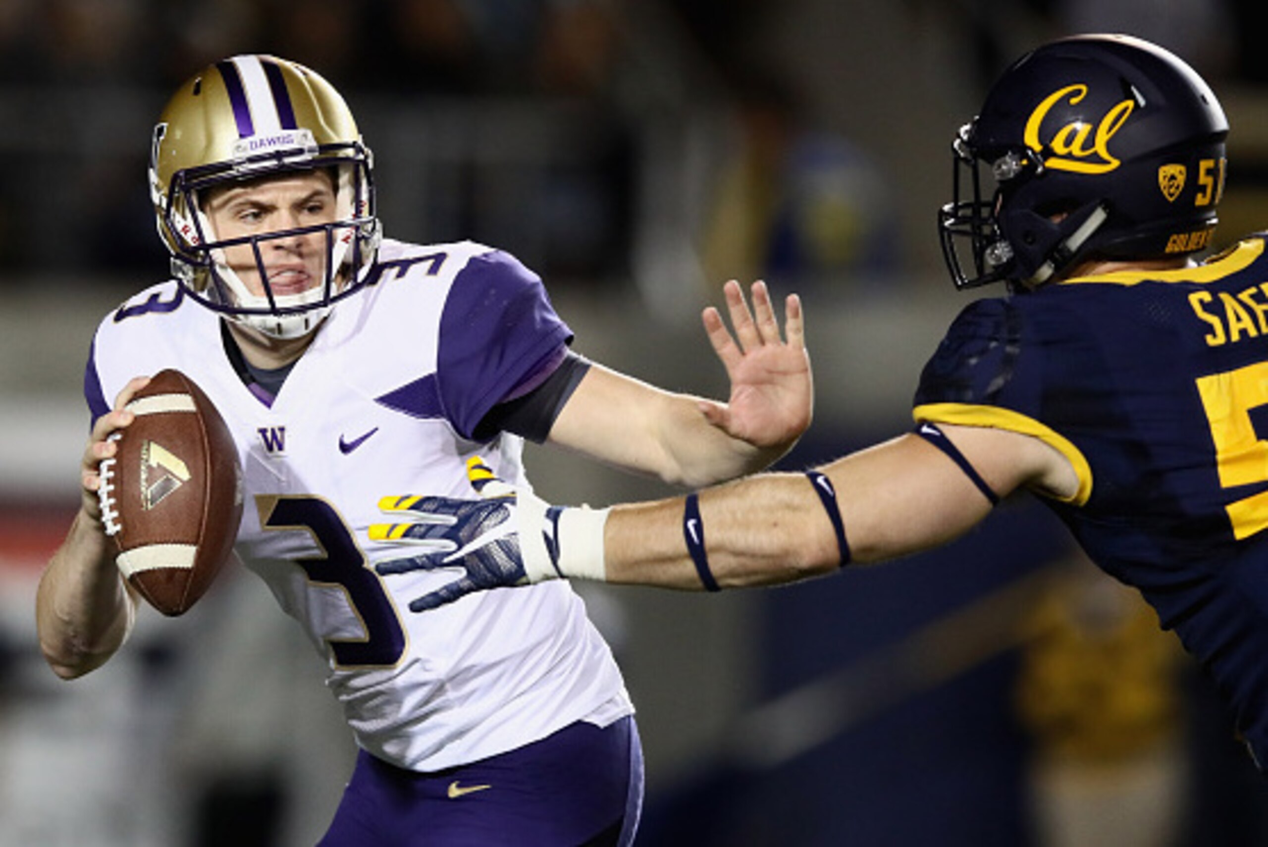 BERKELEY, CA - NOVEMBER 05:  Jake Browning #3 of the Washington Huskies is pressured by Cameron Saffle #51 of the California Golden Bears at California Memorial Stadium on November 5, 2016 in Berkeley, California.  (Photo by Ezra Shaw/Getty Images)
