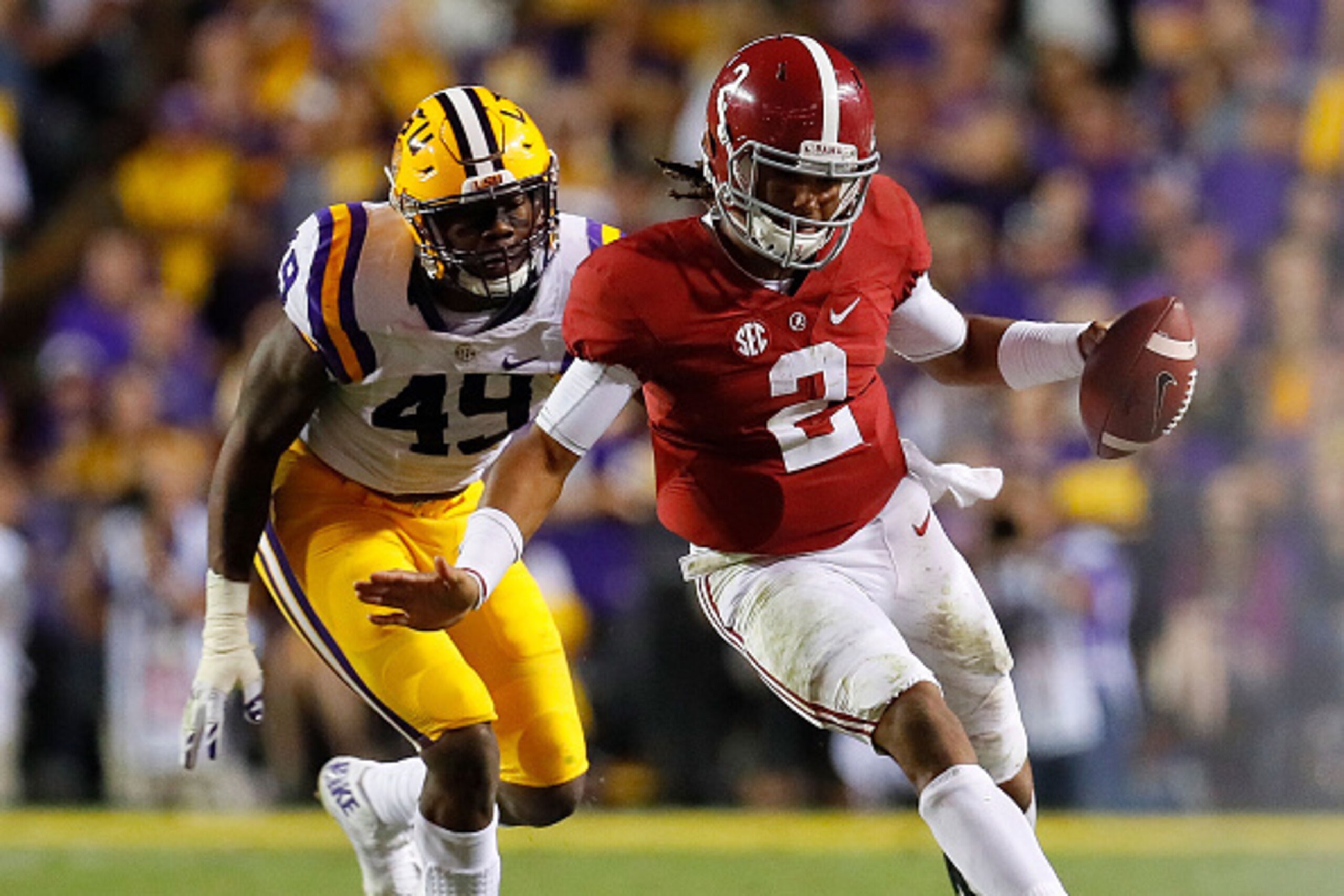 BATON ROUGE, LA - NOVEMBER 05:  Jalen Hurts #2 of the Alabama Crimson Tide rushes away from Arden Key #49 of the LSU Tigers at Tiger Stadium on November 5, 2016 in Baton Rouge, Louisiana.  (Photo by Kevin C. Cox/Getty Images)