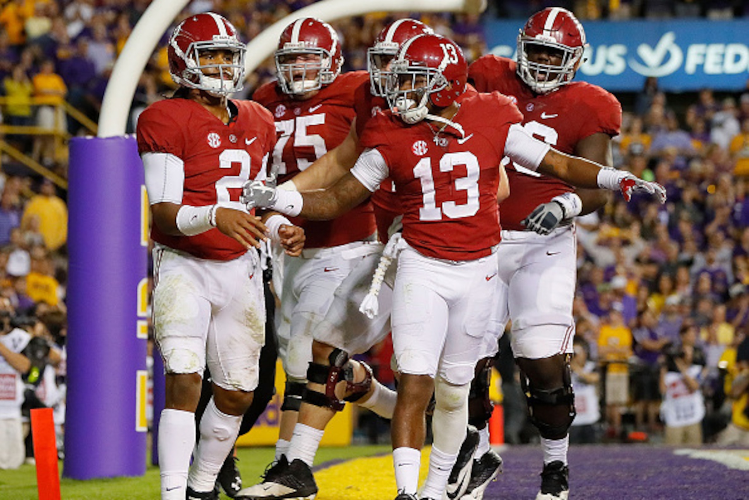 BATON ROUGE, LA - NOVEMBER 05:  Jalen Hurts #2 of the Alabama Crimson Tide is congratulated after rushing for a touchdown against the LSU Tigers at Tiger Stadium on November 5, 2016 in Baton Rouge, Louisiana.  (Photo by Kevin C. Cox/Getty Images)