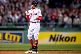 BOSTON, MA - OCTOBER 10: Mookie Betts #50 of the Boston Red Sox reacts after hitting a double during the sixth inning of game three of the American League Division Series against the Cleveland Indians on October 10, 2016 at Fenway Park in Boston, Massachu