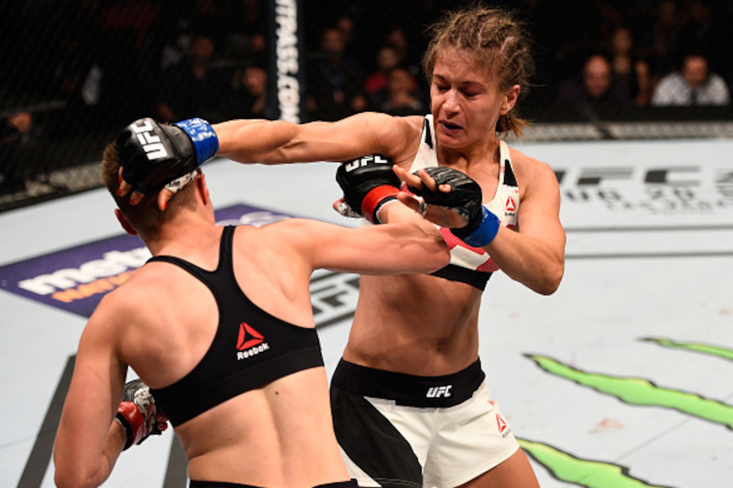 ATLANTA, GA - JULY 30: (R-L) Karolina Kowalkiewicz punches Rose Namajunas in their women's strawweight bout during the UFC 201 event on July 30, 2016 at Philips Arena in Atlanta, Georgia. (Photo by Jeff Bottari/Zuffa LLC/Zuffa LLC via Getty Images) ATLANTA, GA - JULY 30: (R-L) Karolina Kowalkiewicz punches Rose Namajunas in their women's strawweight bout during the UFC 201 event on July 30, 2016 at Philips Arena in Atlanta, Georgia. (Photo by Jeff Bottari/Zuffa LLC/Zuffa LLC via Getty Images)