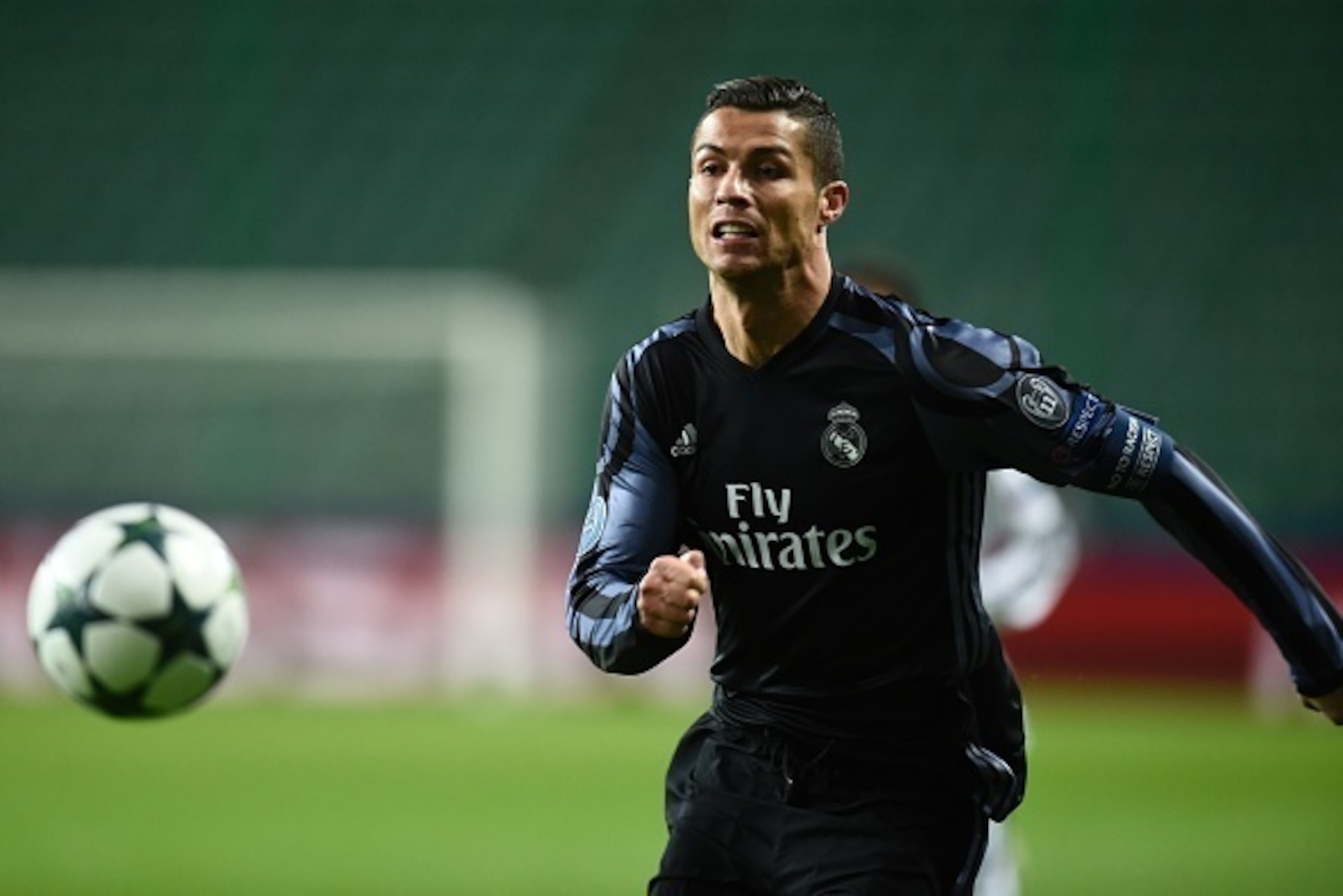 TOPSHOT - Real Madrid's Portuguese forward Cristiano Ronaldo chases the ball during the UEFA Champions League group F football match Legia Warsaw vs Real Madrid CF in Warsaw, Poland on November 2, 2016. / AFP / ODD ANDERSEN        (Photo credit should rea