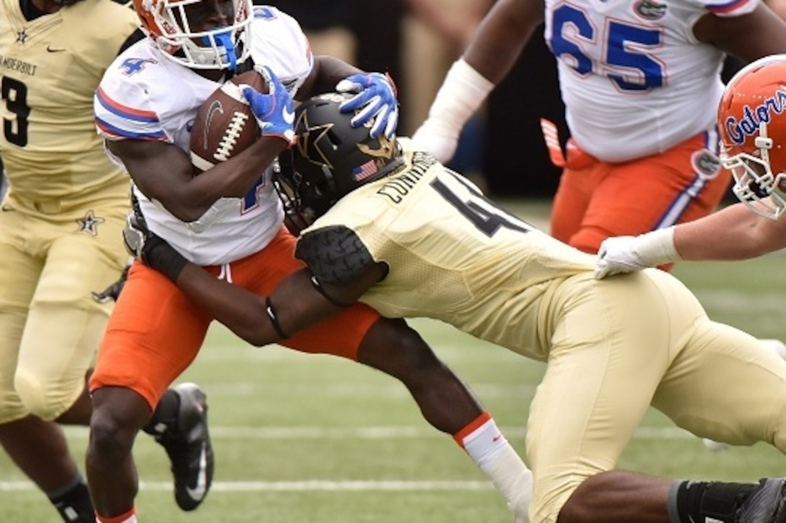 NASHVILLE, TN - OCTOBER 01: Zach Cunningham #41 of the Vanderbilt Commodores tackles Brandon Powell #4 of the Florida Gators during the first half at Vanderbilt Stadium on October 1, 2016 in Nashville, Tennessee. (Photo by Frederick Breedon/Getty Images NASHVILLE, TN - OCTOBER 01: Zach Cunningham #41 of the Vanderbilt Commodores tackles Brandon Powell #4 of the Florida Gators during the first half at Vanderbilt Stadium on October 1, 2016 in Nashville, Tennessee. (Photo by Frederick Breedon/Getty Images