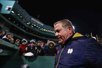 BOSTON, MA - NOVEMBER 21:  Head coach Brian Kelly of the Notre Dame Fighting Irish exits the field after the game against the Boston College Eagles at Fenway Park on November 21, 2015 in Boston, Massachusetts. The Fighting Irish defeat the Eagles 19-16.  