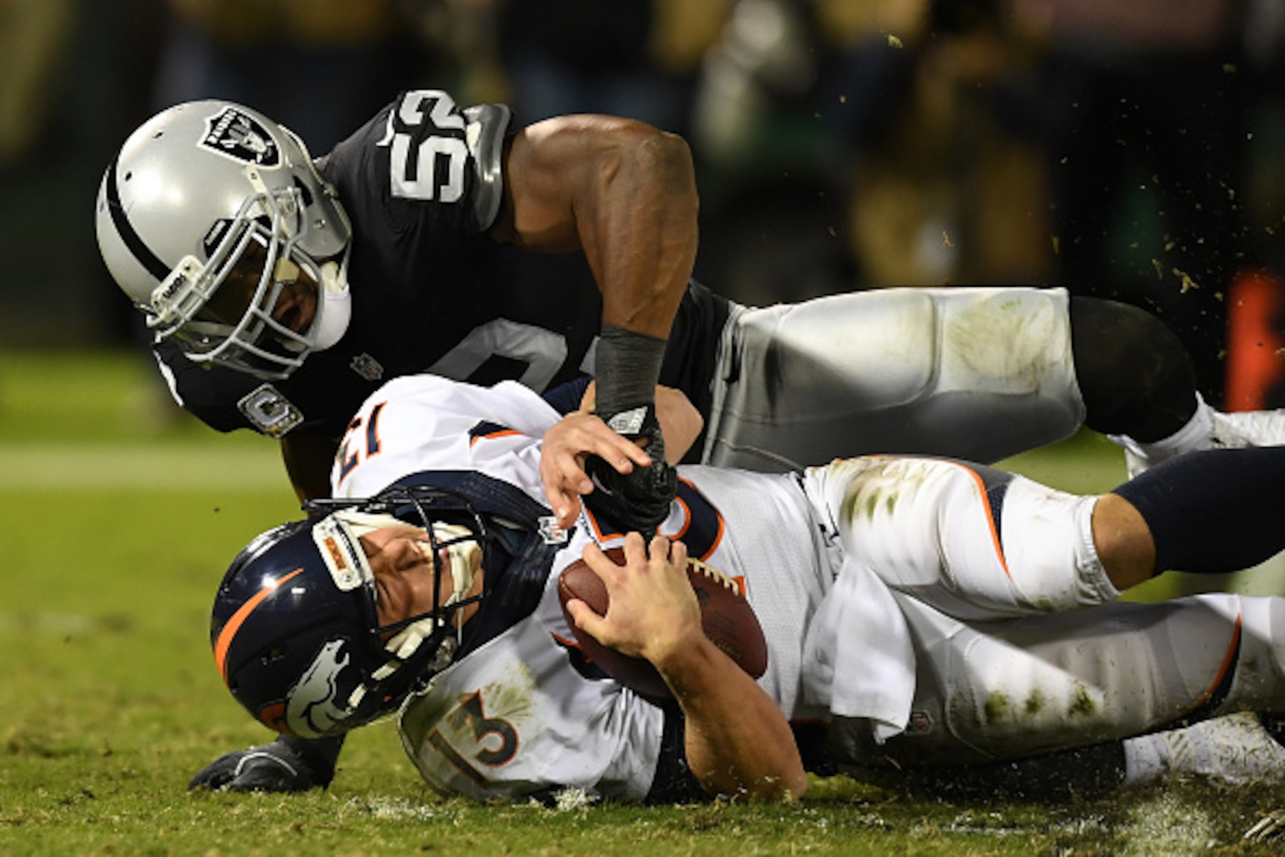 OAKLAND, CA - NOVEMBER 06:   Khalil Mack #52 of the Oakland Raiders sacks Trevor Siemian #13 of the Denver Broncos in their game at Oakland-Alameda County Coliseum on November 6, 2016 in Oakland, California. (Photo by Thearon W. Henderson/Getty Images)
