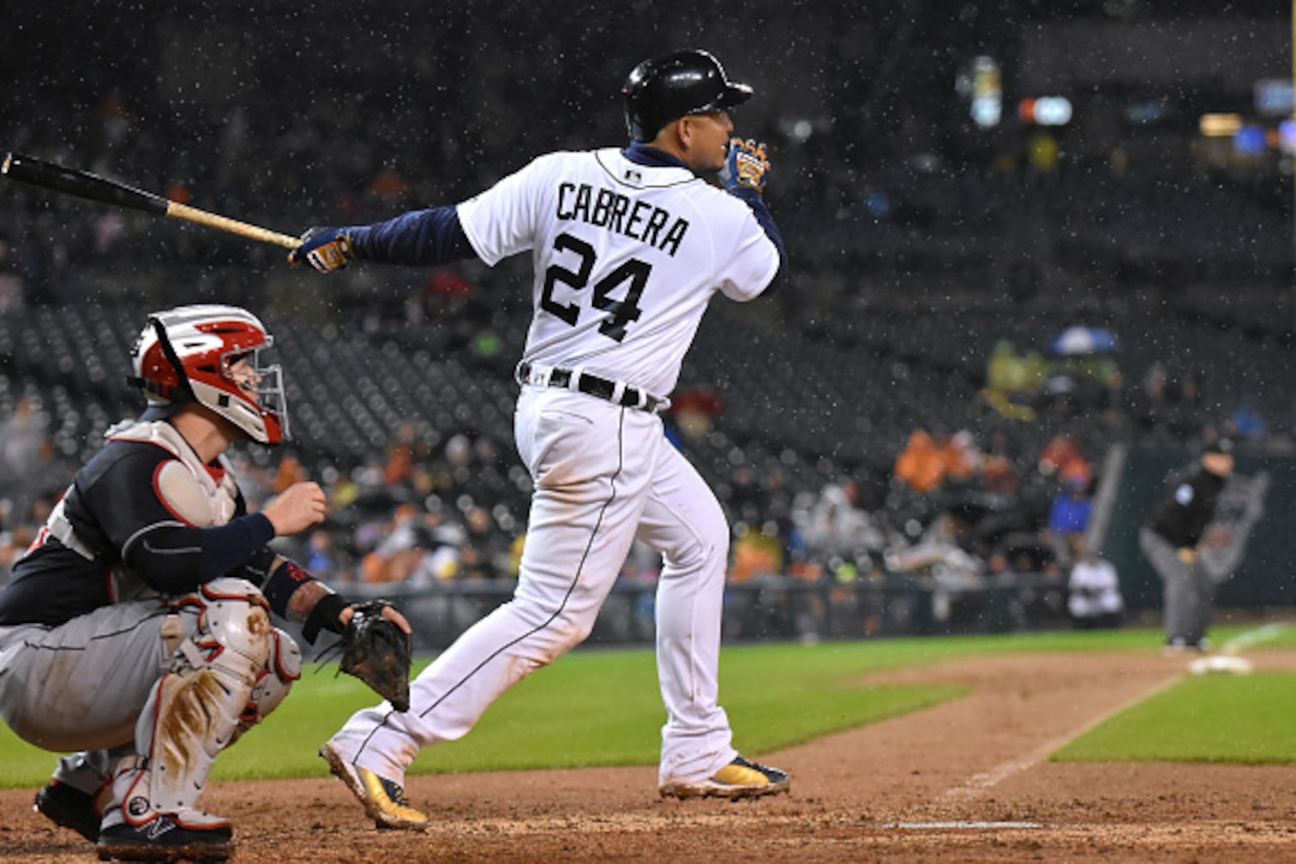 DETROIT, MI - SEPTEMBER 28:  Miguel Cabrera #24 of the Detroit Tigers hits a 3-run home run in the rain during the game against the Cleveland Indians at Comerica Park on September 28, 2016 in Detroit, Michigan. The Tigers defeated the Indians 6-3.  (Photo