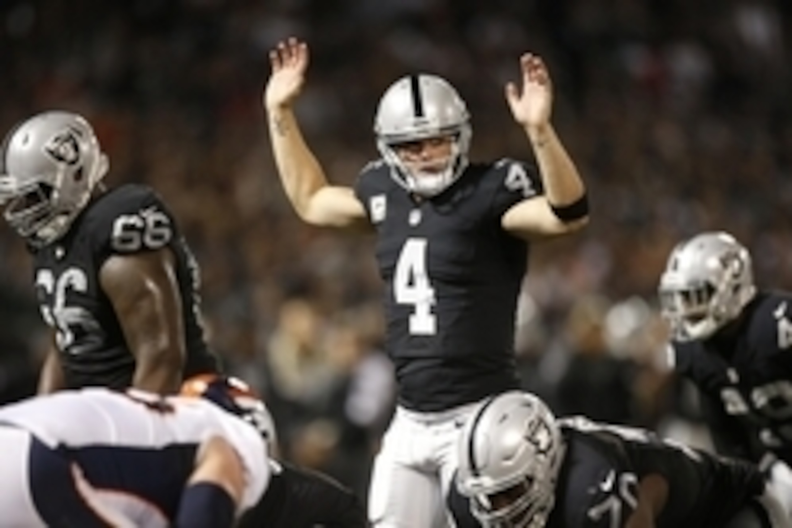 Nov 6, 2016; Oakland, CA, USA; Oakland Raiders quarterback Derek Carr (4) calls a play against the Denver Broncos in the second quarter at Oakland Coliseum. Mandatory Credit: Cary Edmondson-USA TODAY Sports