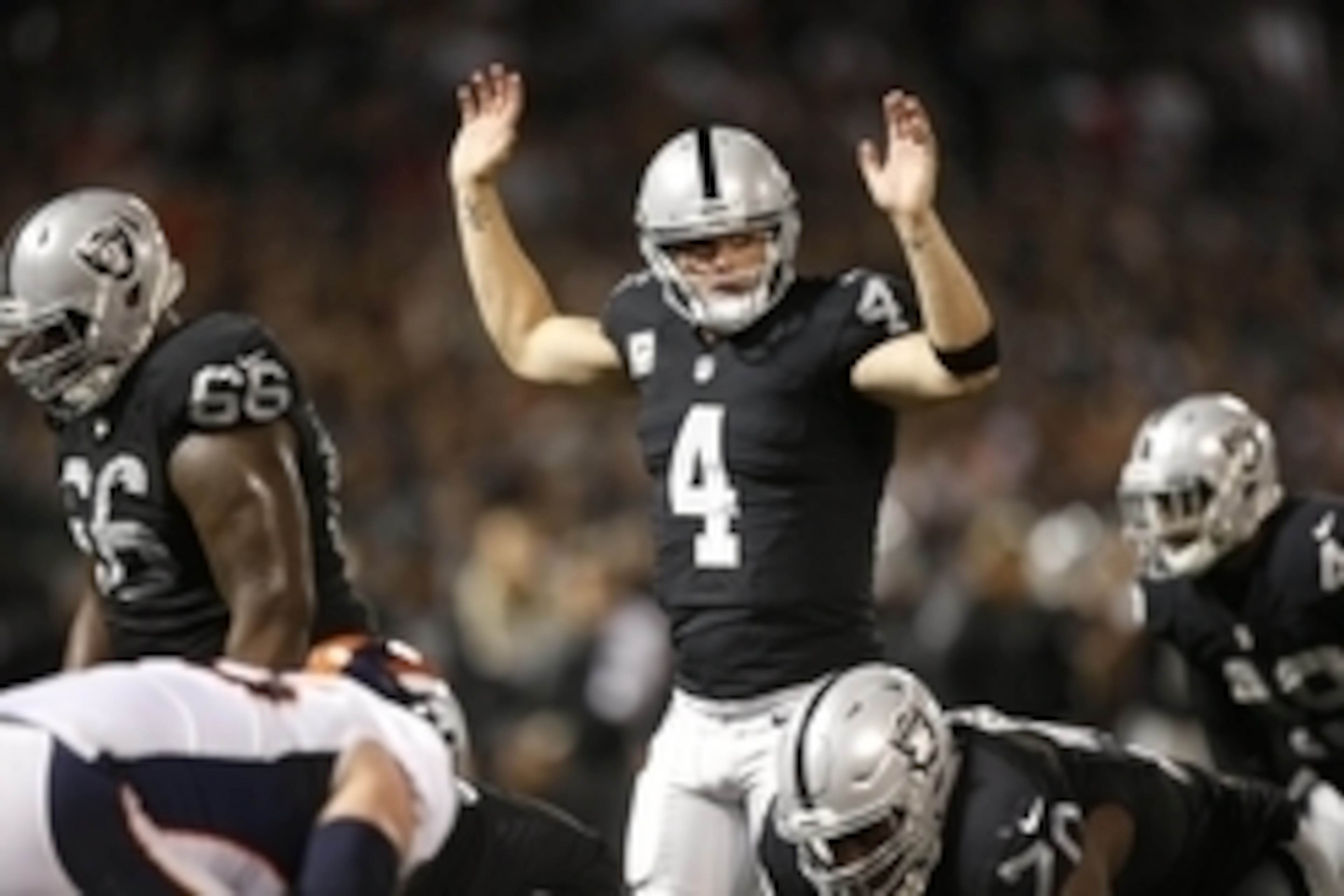 Nov 6, 2016; Oakland, CA, USA; Oakland Raiders quarterback Derek Carr (4) calls a play against the Denver Broncos in the second quarter at Oakland Coliseum. Mandatory Credit: Cary Edmondson-USA TODAY Sports