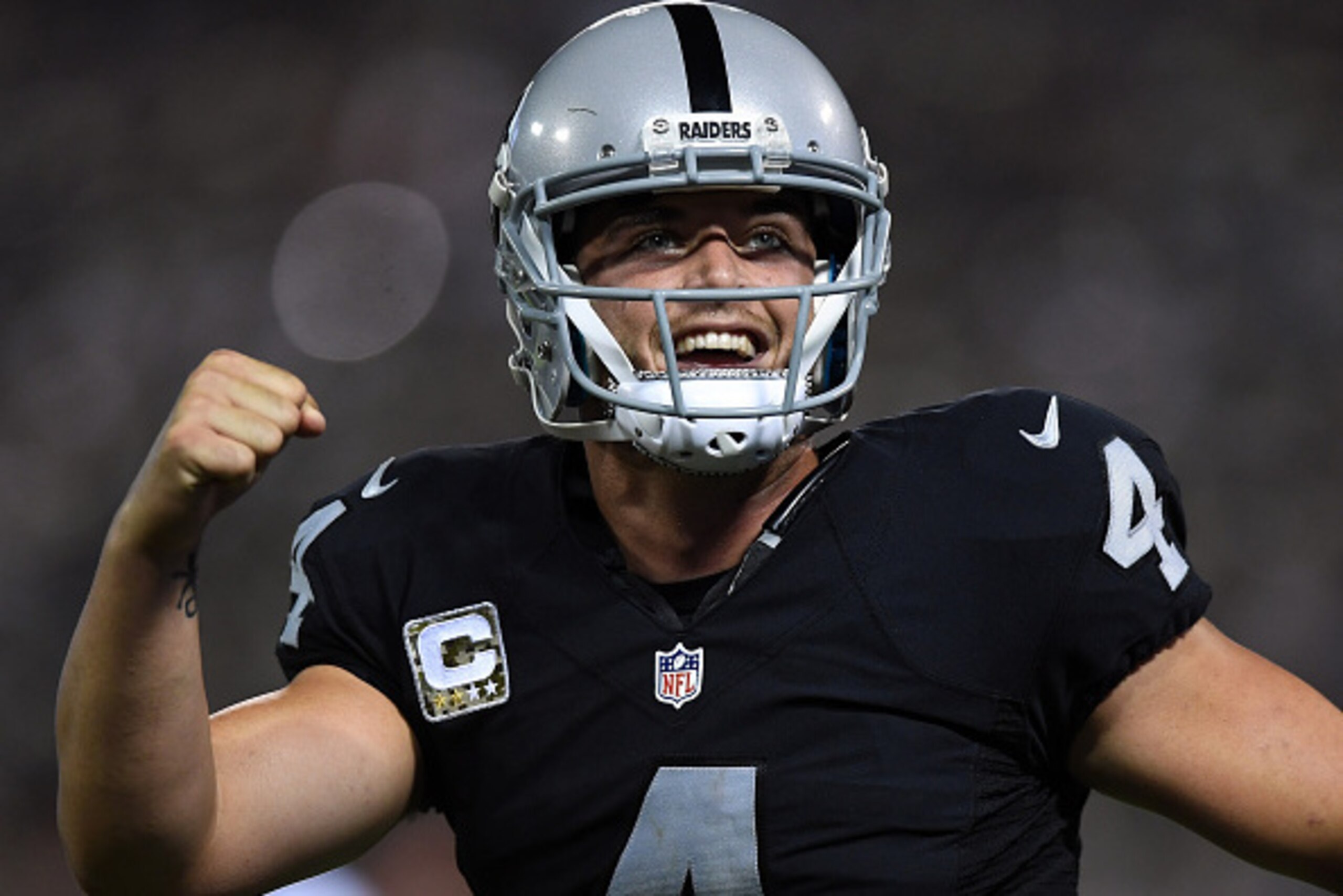 OAKLAND, CA - NOVEMBER 06:   Derek Carr #4 of the Oakland Raiders celebrates after a touchdown during the fourth quarter against the Denver Broncos at Oakland-Alameda County Coliseum on November 6, 2016 in Oakland, California. (Photo by Thearon W. Henders
