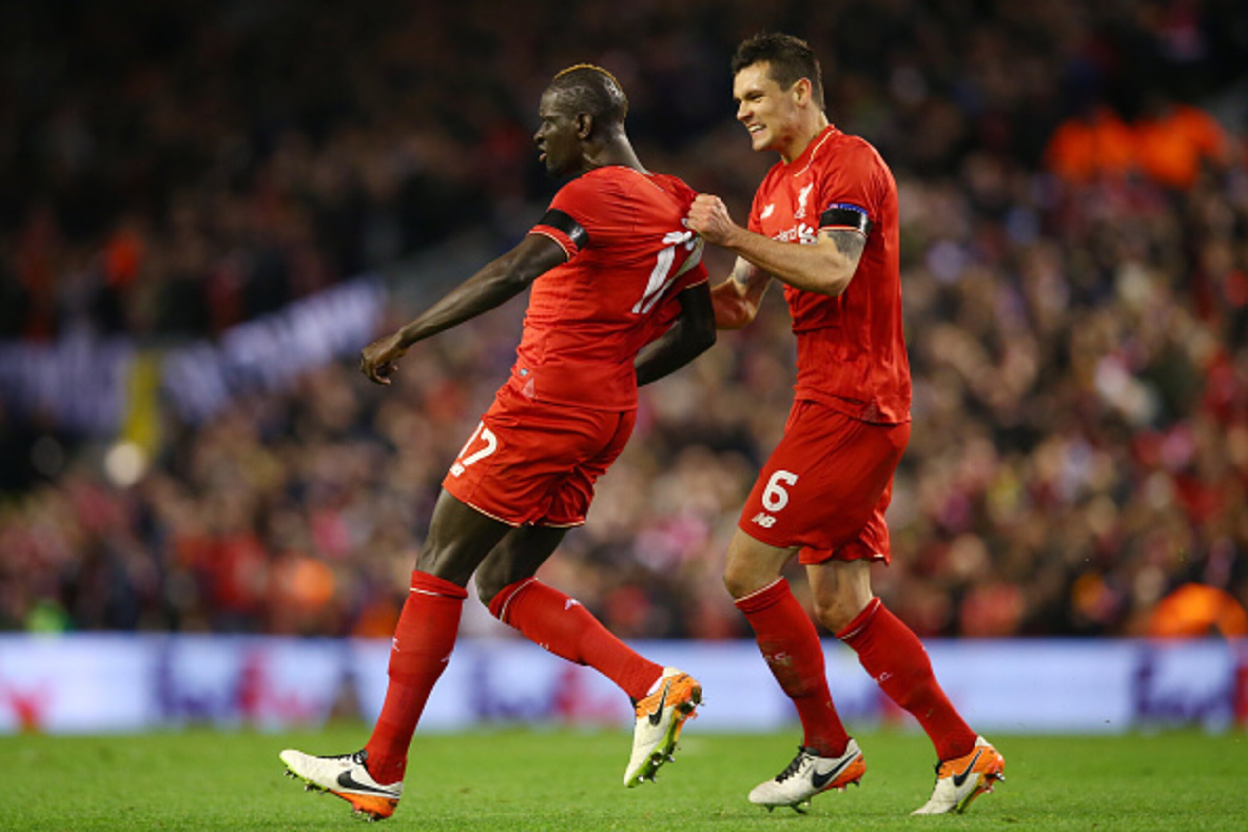 LIVERPOOL, ENGLAND - APRIL 14:  Mamadou Sakho of Liverpool celebrates scoring his team's third goal with Dejan Lovren during the UEFA Europa League quarter final, second leg match between Liverpool and Borussia Dortmund at Anfield on April 14, 2016 in Liv