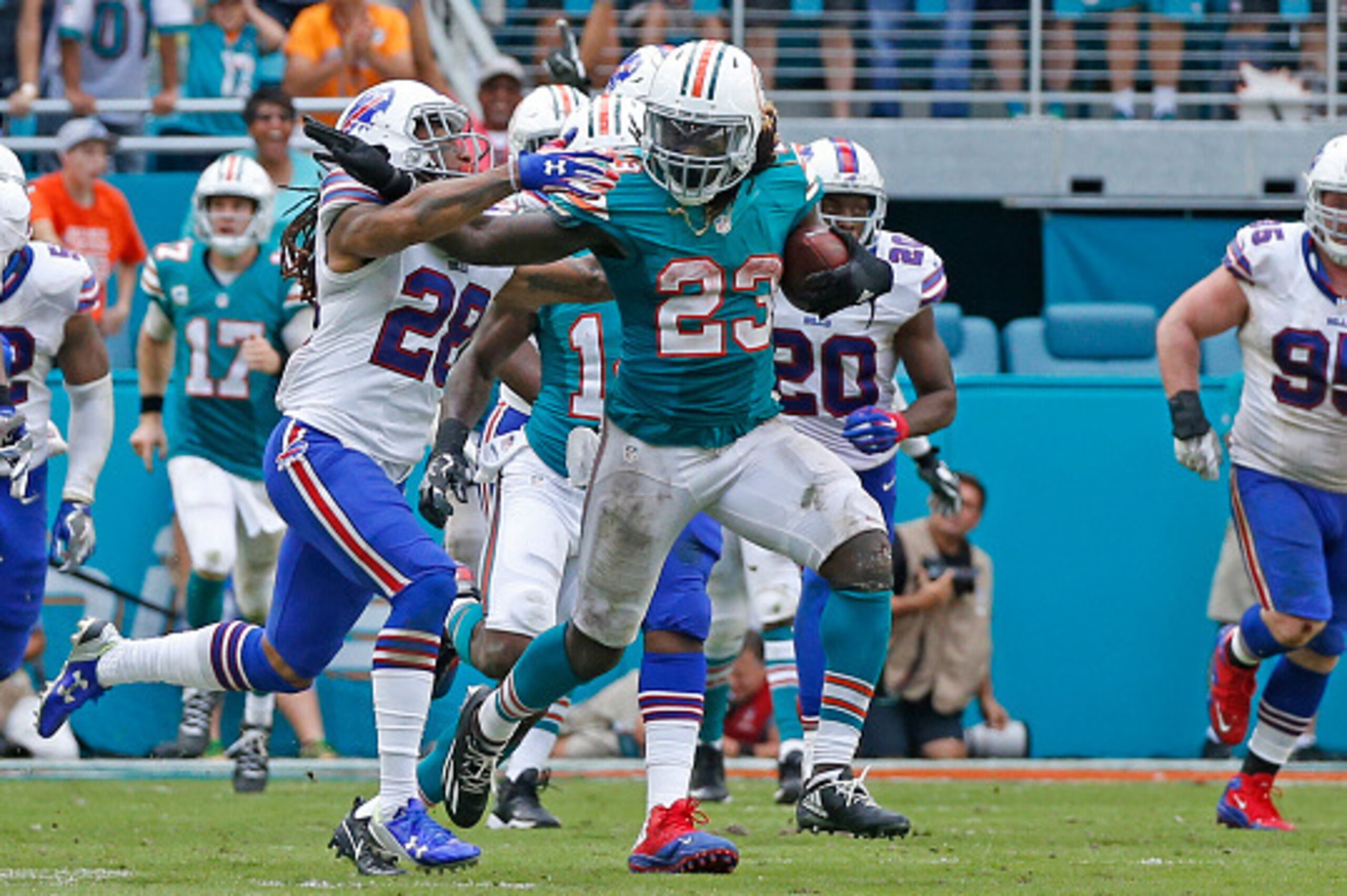 MIAMI GARDENS, FL - OCTOBER 23: Jay Ajayi #23 of the Miami Dolphins battles with Ronald Darby #28 of the Buffalo Bills on October 23, 2016 at Hard Rock Stadium in Miami Gardens, Florida. Miami defeated Buffalo 28-25. (Photo by Joel Auerbach/Getty Images)