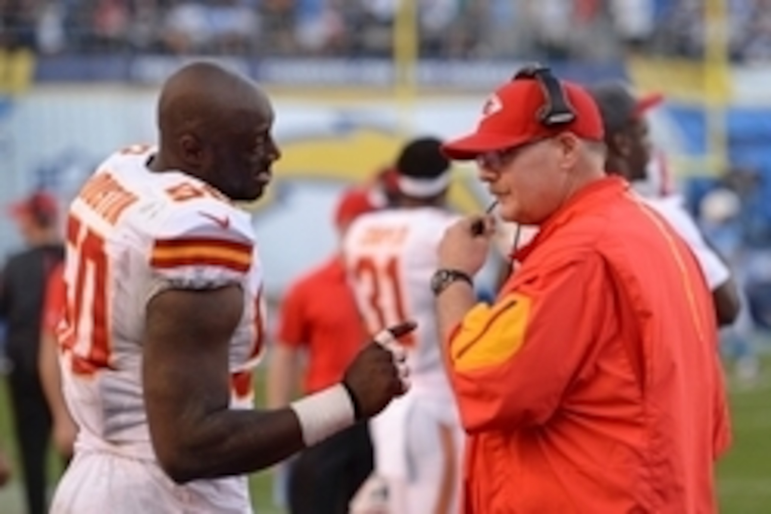 Nov 22, 2015; San Diego, CA, USA; Kansas City Chiefs head coach Andy Reid talks to outside linebacker Justin Houston (50) during the fourth quarter against the San Diego Chargers at Qualcomm Stadium. Mandatory Credit: Jake Roth-USA TODAY Sports