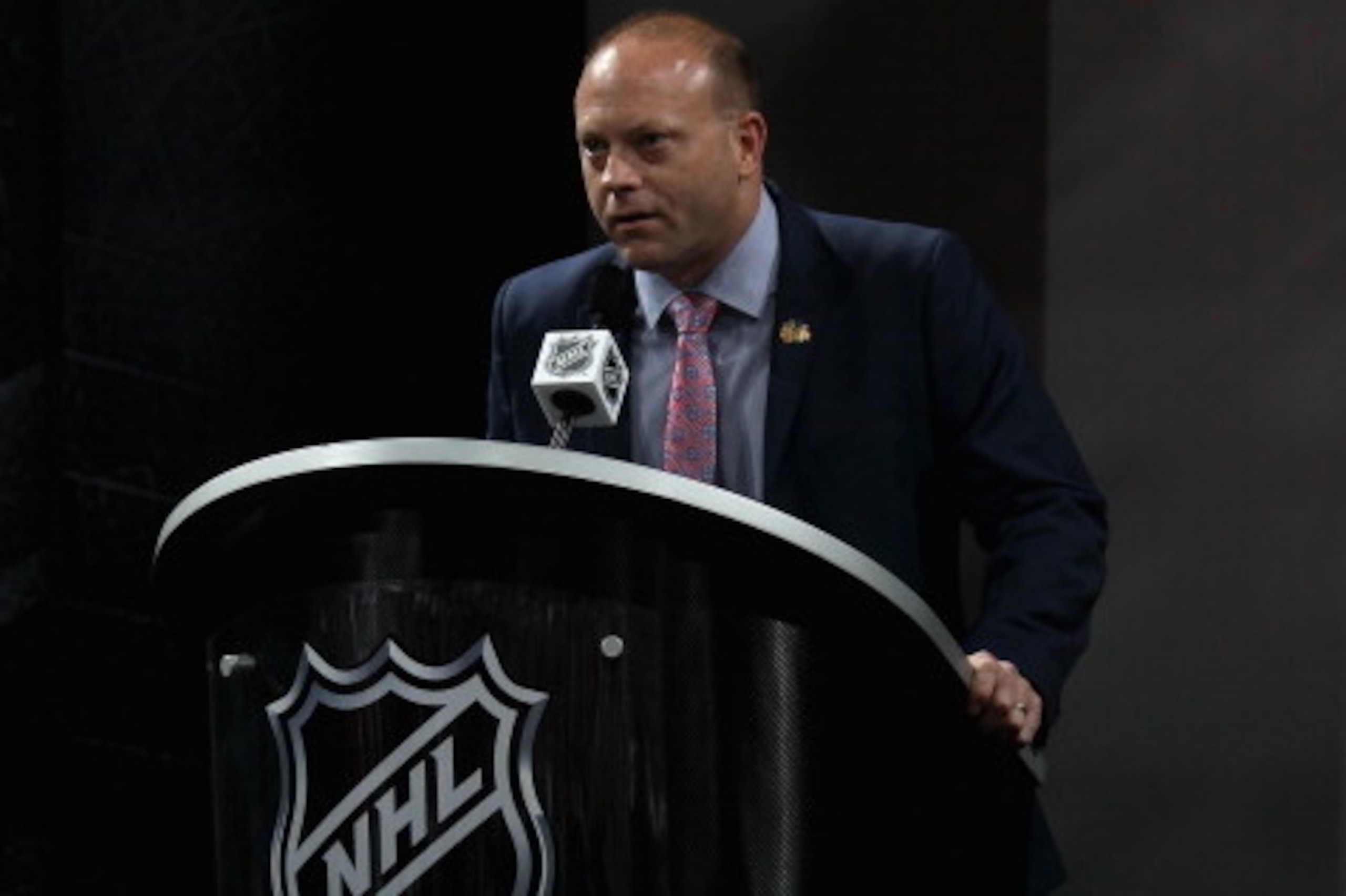 NEWARK, NJ - JUNE 30: Vice President and General Manager Stan Bowman of the Chicago Blackhawks speaks at the podium during the 2013 NHL Draft at the Prudential Center on June 30, 2013 in Newark, New Jersey. (Photo by Bruce Bennett/Getty Images) NEWARK, NJ - JUNE 30: Vice President and General Manager Stan Bowman of the Chicago Blackhawks speaks at the podium during the 2013 NHL Draft at the Prudential Center on June 30, 2013 in Newark, New Jersey. (Photo by Bruce Bennett/Getty Images)