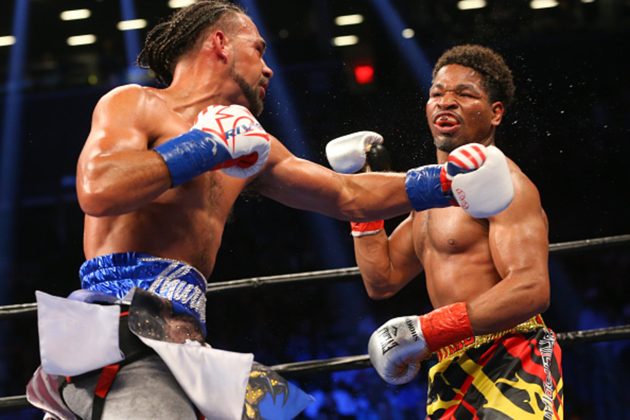 BROOKLYN, NY - JUNE 25: Keith Thurman (left) lands a left hand to the head of Shawn Porter (right) during their 12 round WBA welterweight championship bout at the Barclays Center on June 25, 2016 in the Brooklyn borough of New York City. (Photo by Ed Mulh