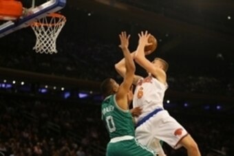 Oct 15, 2016; New York, NY, USA; New York Knicks forward Kristaps Porzingis (6) goes up for a shot against Boston Celtics guard Avery Bradley (0) during the first half at Madison Square Garden. The Celtics won 119-107. Mandatory Credit: Andy Marlin-USA TO
