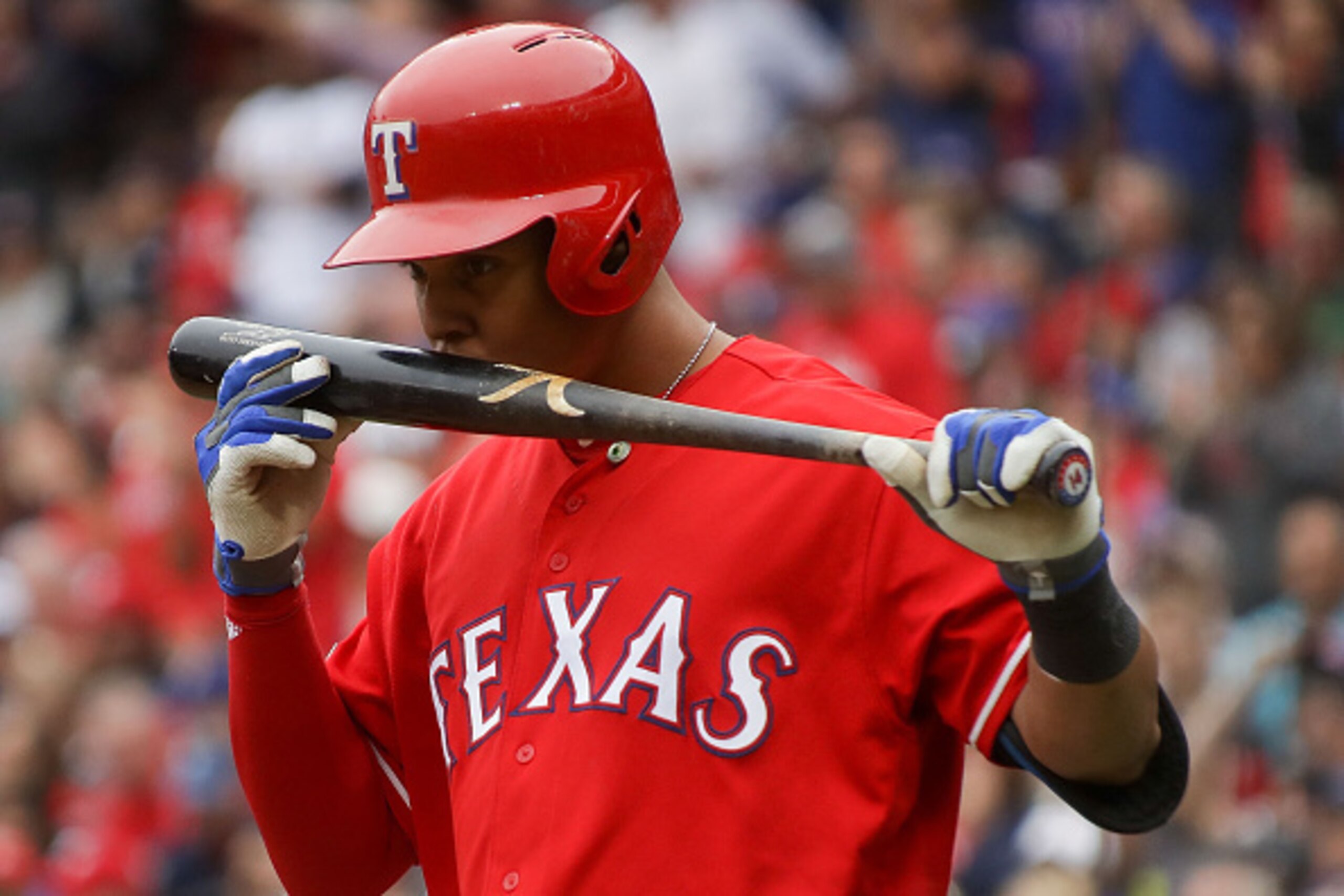 ARLINGTON, TX - OCTOBER 07:  Carlos Gomez #14 of the Texas Rangers kisses his bat prior to his at-bat against the Toronto Blue Jays in the eighth inning of game two of the American League Divison Series at Globe Life Park in Arlington on October 7, 2016 i