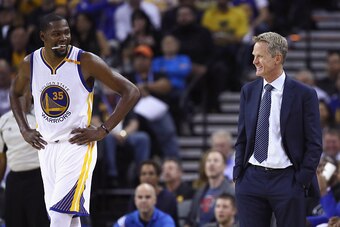 OAKLAND, CA - OCTOBER 04:  Head coach Steve Kerr of the Golden State Warriors talks to Kevin Durant #35 during their preseason game against the Los Angeles Clippers at ORACLE Arena on October 4, 2016 in Oakland, California.  NOTE TO USER: User expressly a