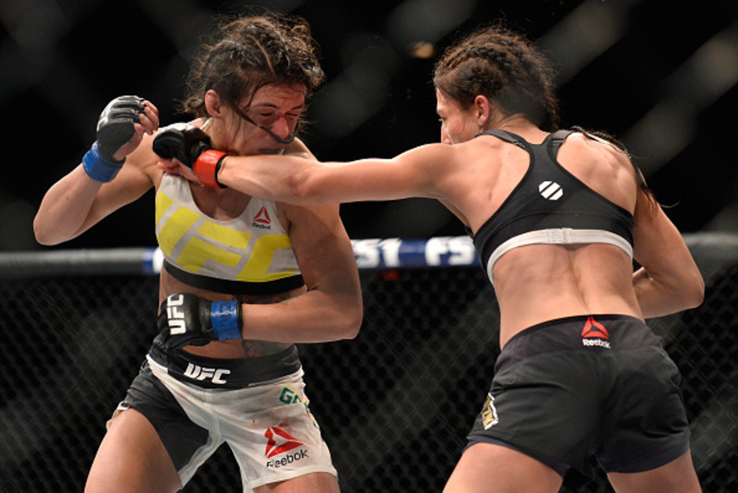 LAS VEGAS, NV - JULY 08: (R-L) Joanna Jedrzejczyk of Poland punches Claudia Gadelha of Brazil in their women's strawweight championship bout during The Ultimate Fighter Finale event at MGM Grand Garden Arena on July 8, 2016 in Las Vegas, Nevada. (Photo LAS VEGAS, NV - JULY 08: (R-L) Joanna Jedrzejczyk of Poland punches Claudia Gadelha of Brazil in their women's strawweight championship bout during The Ultimate Fighter Finale event at MGM Grand Garden Arena on July 8, 2016 in Las Vegas, Nevada. (Photo