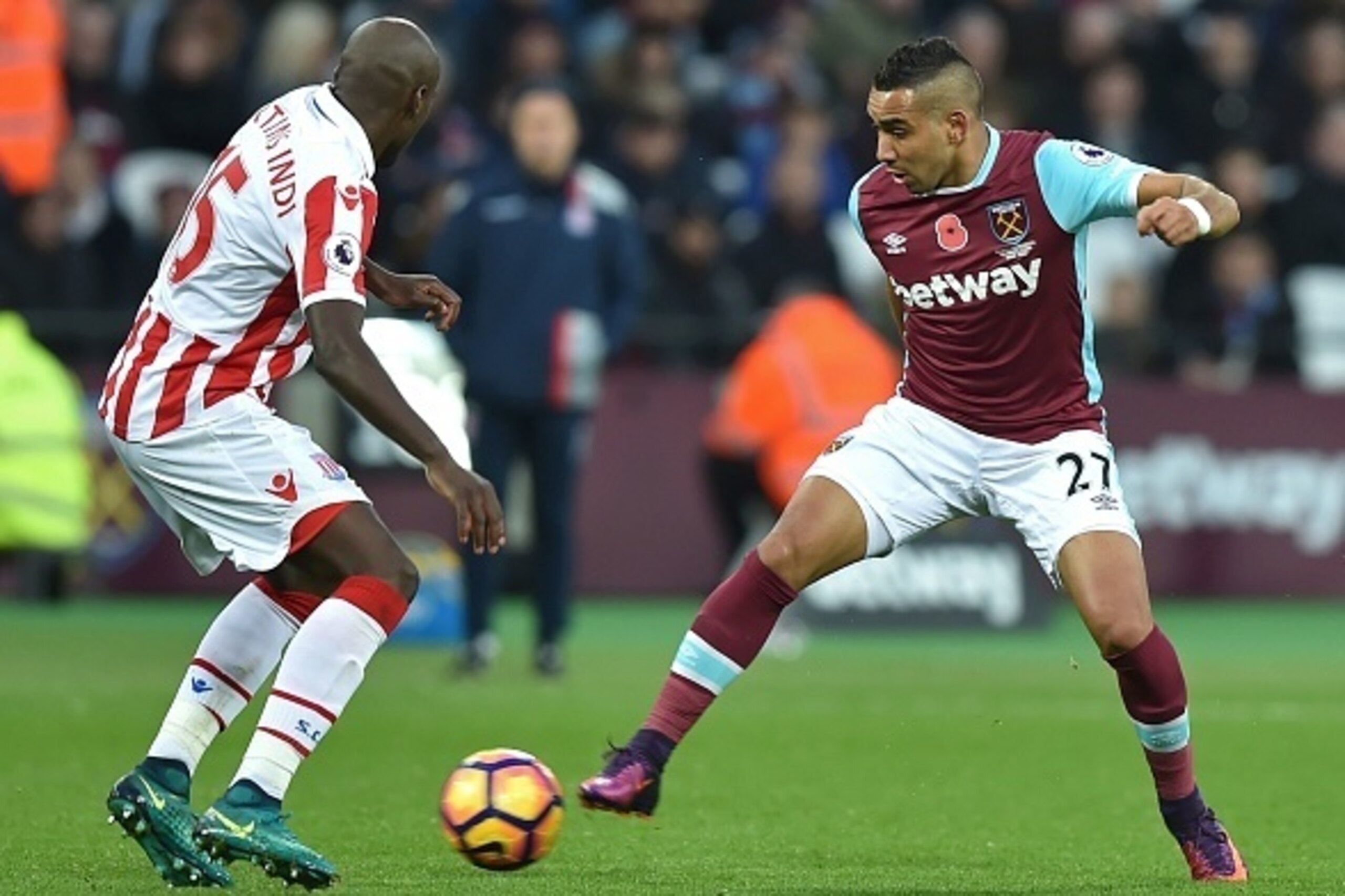 West Ham United's French midfielder Dimitri Payet (R) vies with Stoke City's Portuguese-born Dutch defender Bruno Martins Indi during the English Premier League football match between West Ham United and Stoke City at The London Stadium, in east London on