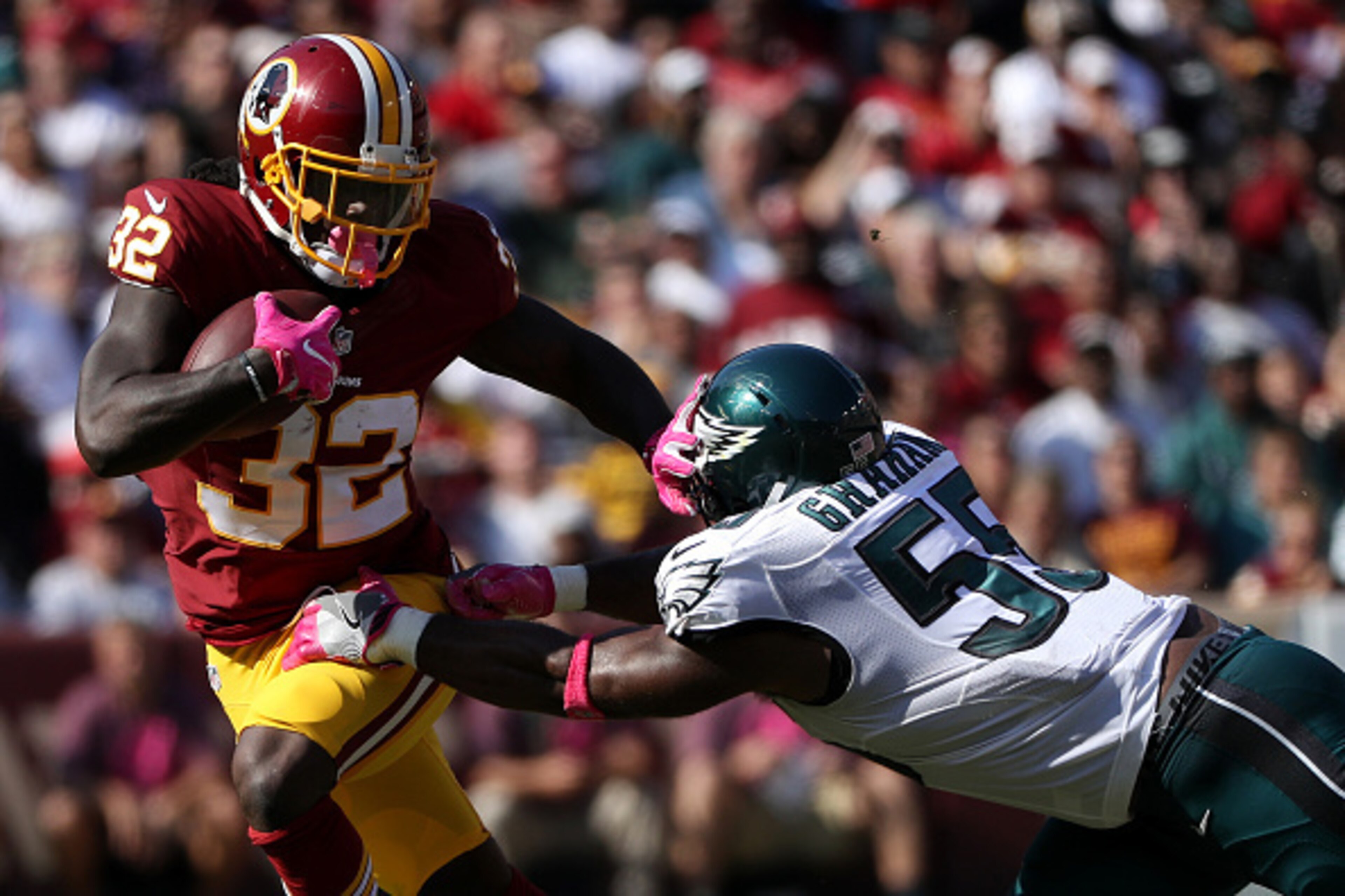 LANDOVER, MD - OCTOBER 16: Running back Rob Kelley #32 of the Washington Redskins carries the ball against defensive end Brandon Graham #55 of the Philadelphia Eagles in the second quarter at FedExField on October 16, 2016 in Landover, Maryland. (Photo by