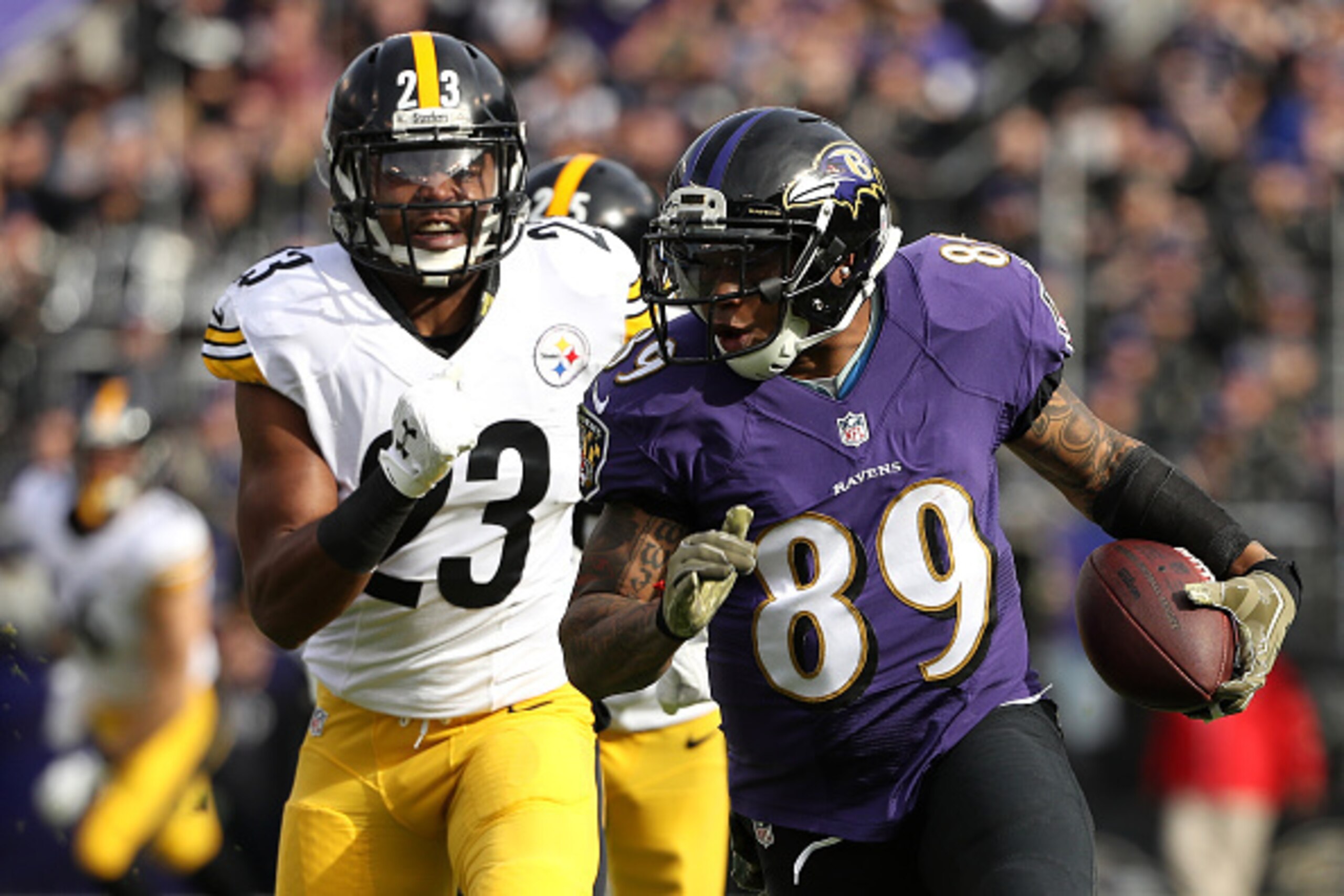BALTIMORE, MD - NOVEMBER 6: Wide receiver Steve Smith #89 of the Baltimore Ravens carries the ball against free safety Mike Mitchell #23 of the Pittsburgh Steelers in the first quarter at M&T Bank Stadium on November 6, 2016 in Baltimore, Maryland. (Photo