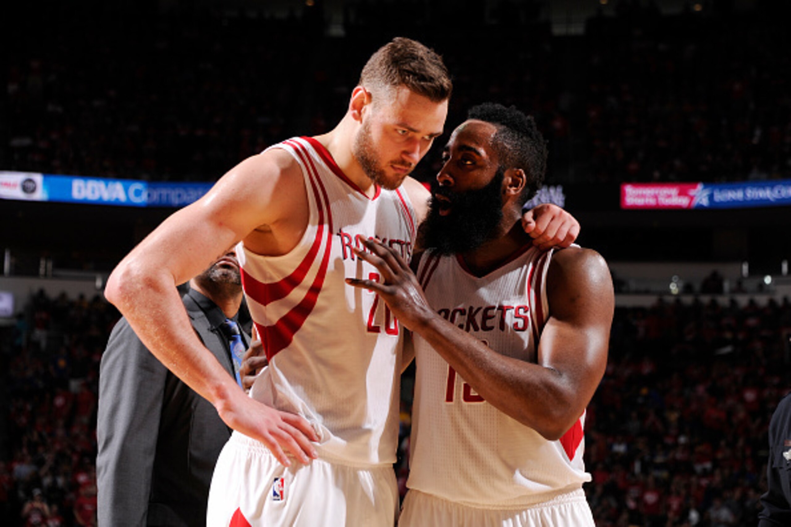 HOUSTON, TX - APRIL 24:  James Harden #13 of the Houston Rockets and Donatas Motiejunas #20 of the Houston Rockets talk during the game against the Golden State Warriors in Game Four of the Western Conference Quarterfinals during the 2016 NBA Playoffs on 