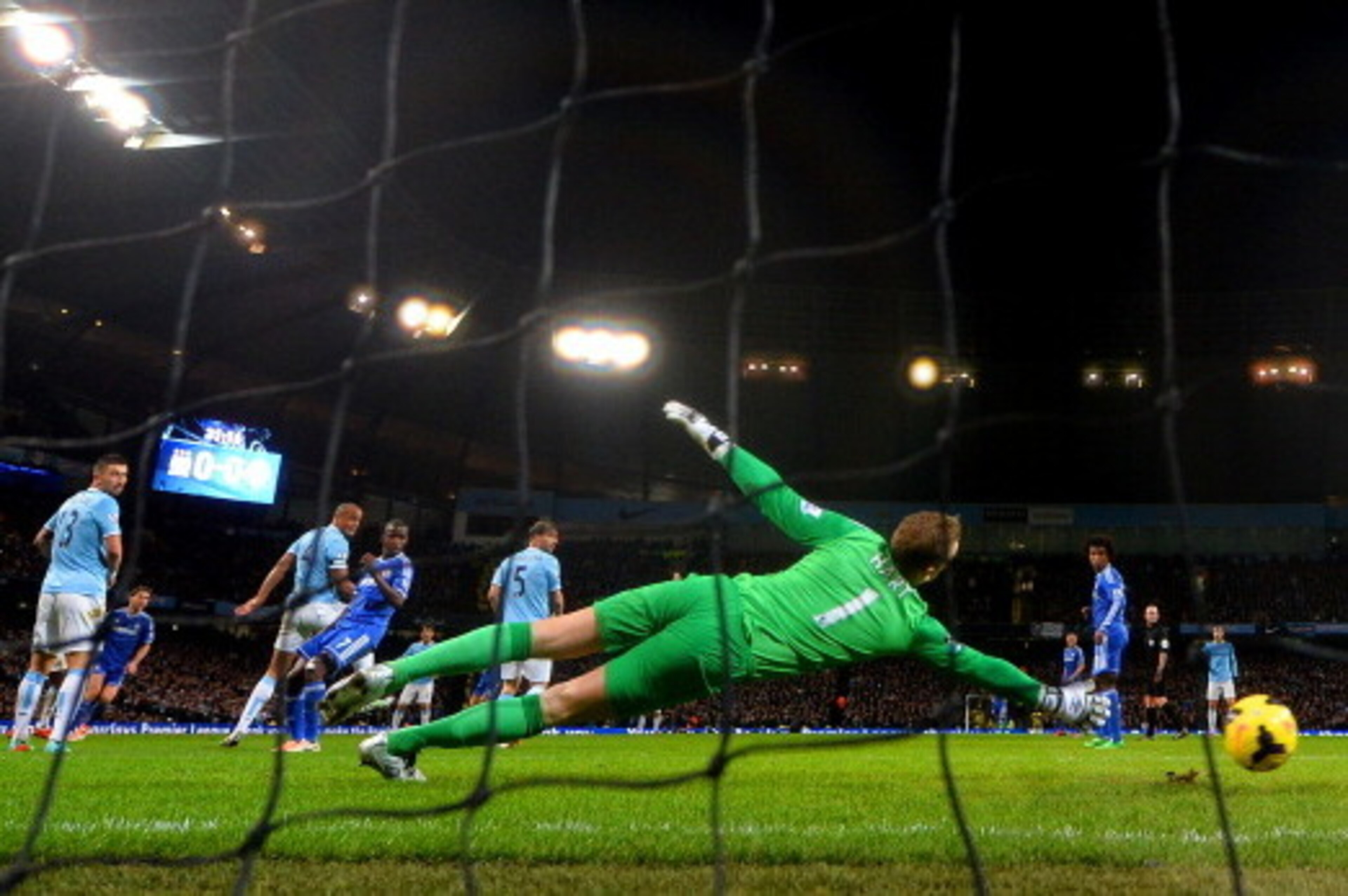 MANCHESTER, ENGLAND - FEBRUARY 03:  Joe Hart of Manchester City fails to stop Branislav Ivanovic of Chelsea (obstructed) scoring the opening goal during the Barclays Premier League match between Manchester City and Chelsea at Etihad Stadium on February 3,