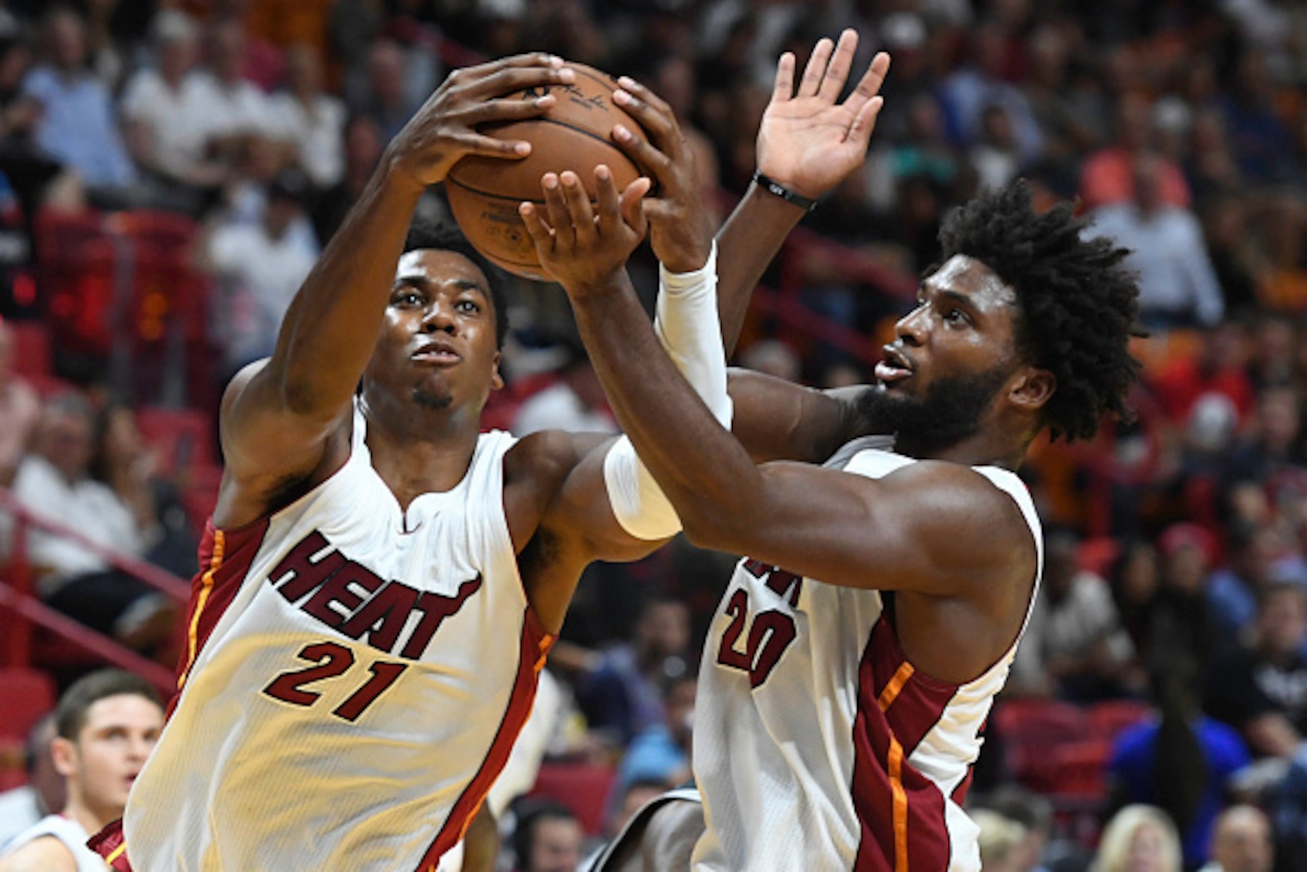 MIAMI, FL - OCTOBER 30:  Hassan Whiteside #21 and Justise Winslow #20 of the Miami Heat in action during a NBA game against he San Antonio Spurs at American Airlines Arena on October 30, 2016 in Miami, Florida. NOTE TO USER: User expressly acknowledges an