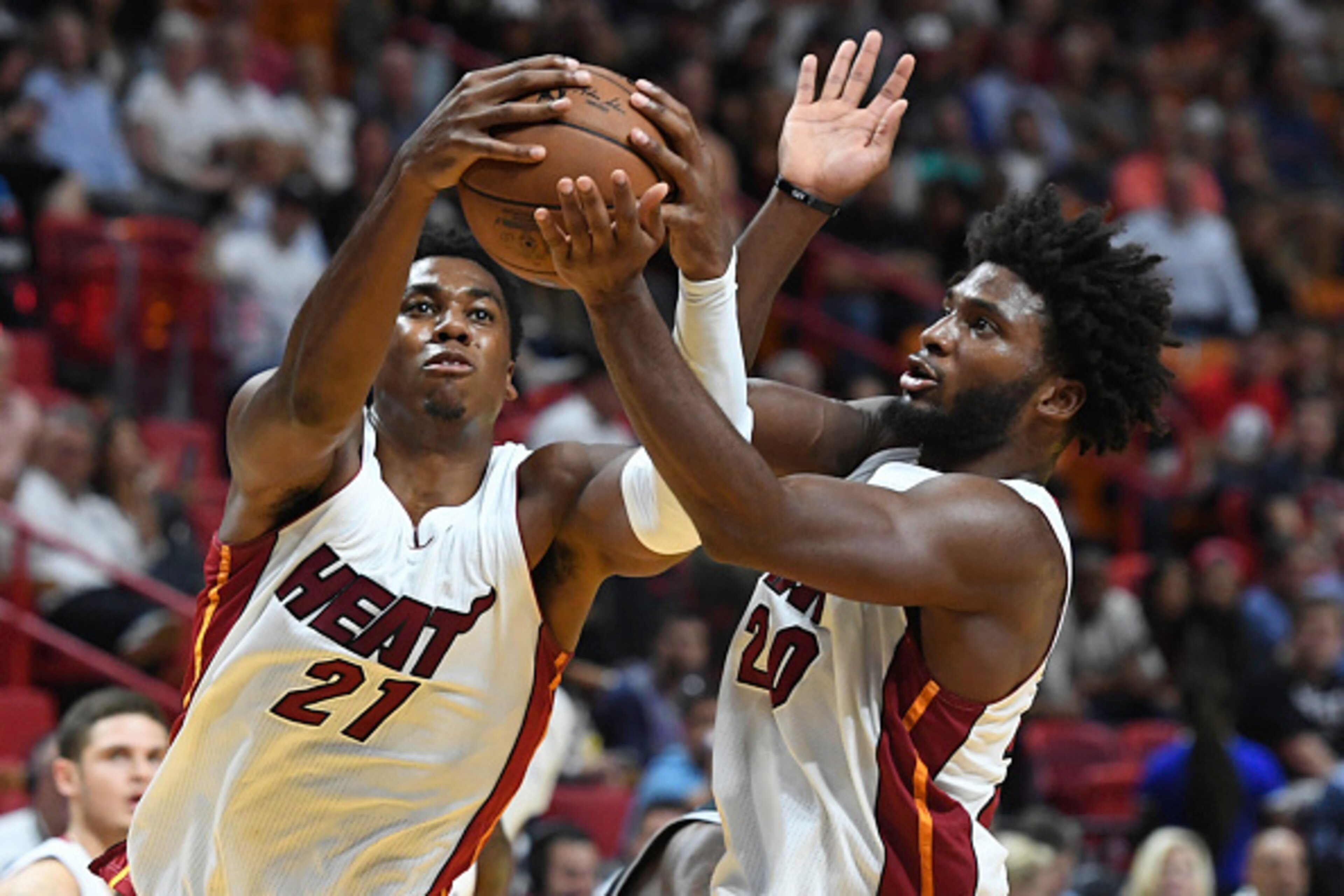 MIAMI, FL - OCTOBER 30:  Hassan Whiteside #21 and Justise Winslow #20 of the Miami Heat in action during a NBA game against he San Antonio Spurs at American Airlines Arena on October 30, 2016 in Miami, Florida. NOTE TO USER: User expressly acknowledges an